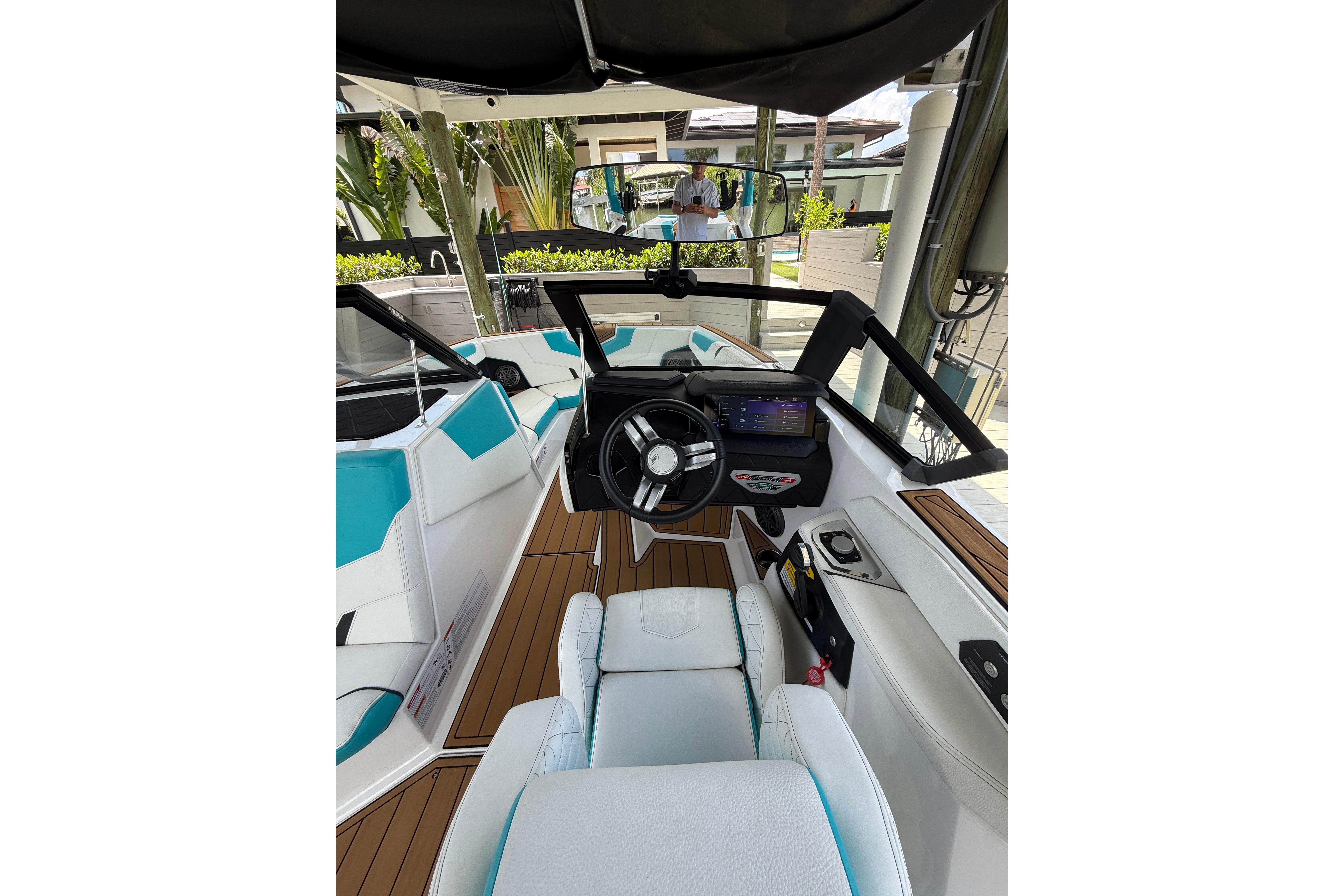 2024 Nautique Super Air Nautique GS20 boat interior with modern dashboard and seating.