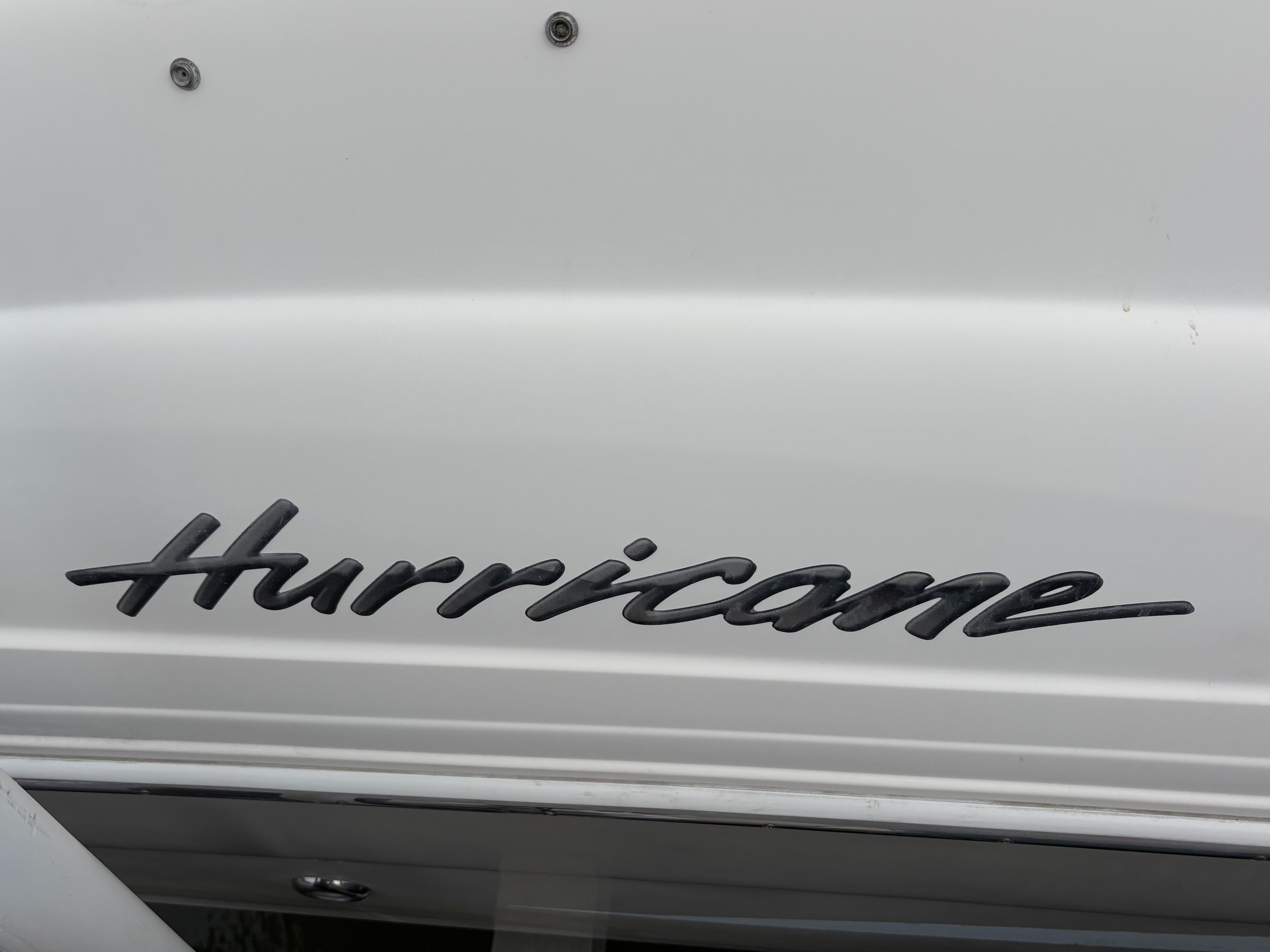 "Hurricane" logo on a 2009 SUN DECK 260 boat.