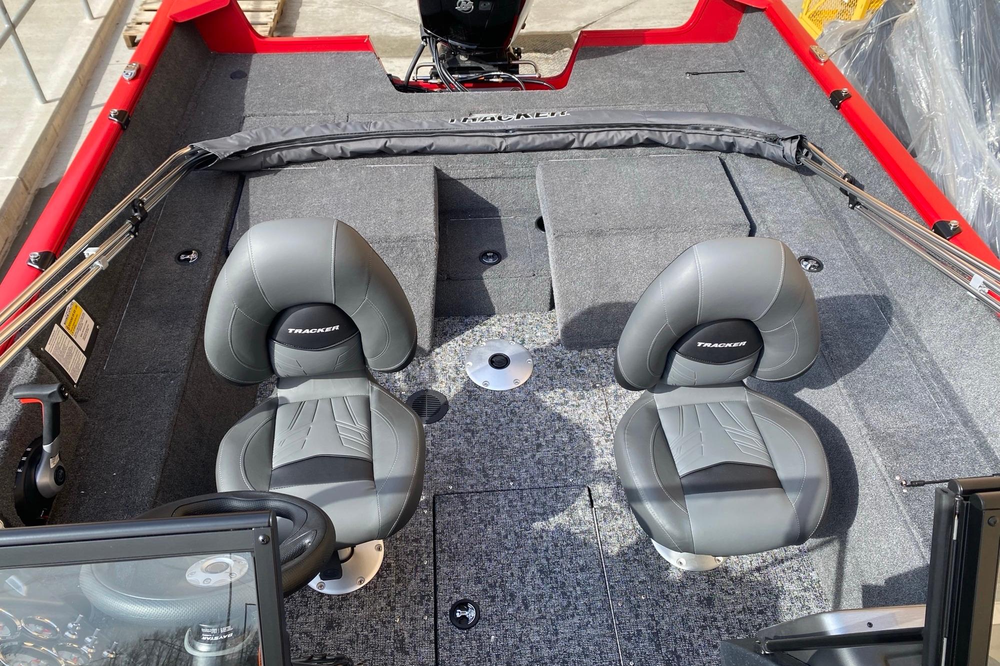 2026 Tracker Pro Guide V-175 Combo boat interior with two gray seats and carpeted flooring.