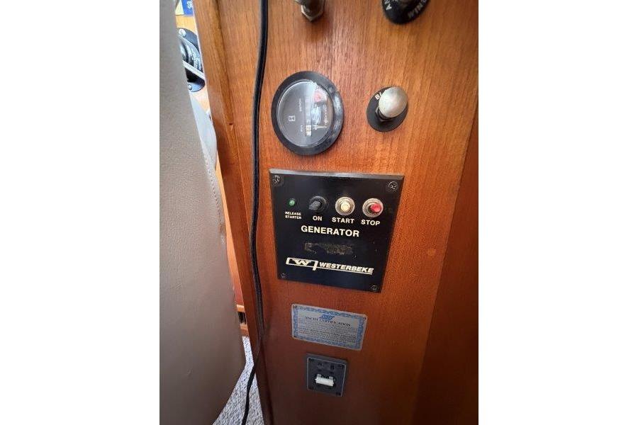 Control panel of a 1987 Tollycraft 34 Sundeck Motor Yacht with Westerbeke generator.