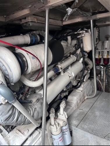 Engine room of 1986 Egg Harbor 60 Sportfisherman, showcasing complex machinery and components.