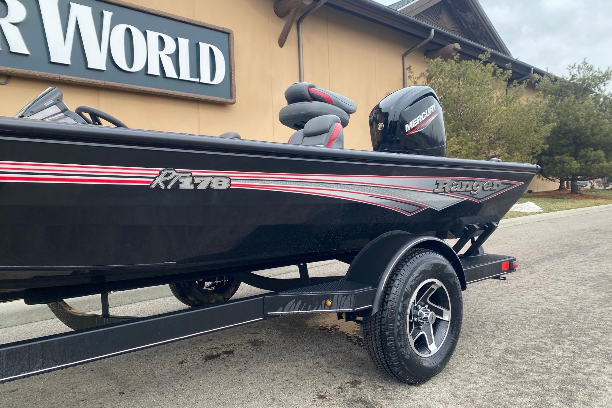 2025 Ranger RT178 boat with Mercury engine on trailer, parked outside showroom.
