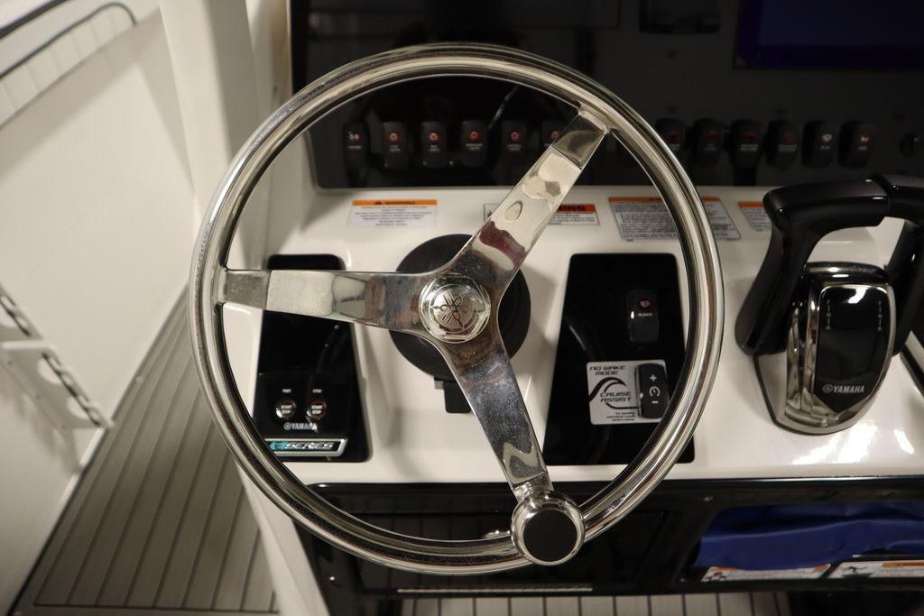Steering wheel and controls of 2026 Yamaha Boats 255 FSH Sport E.