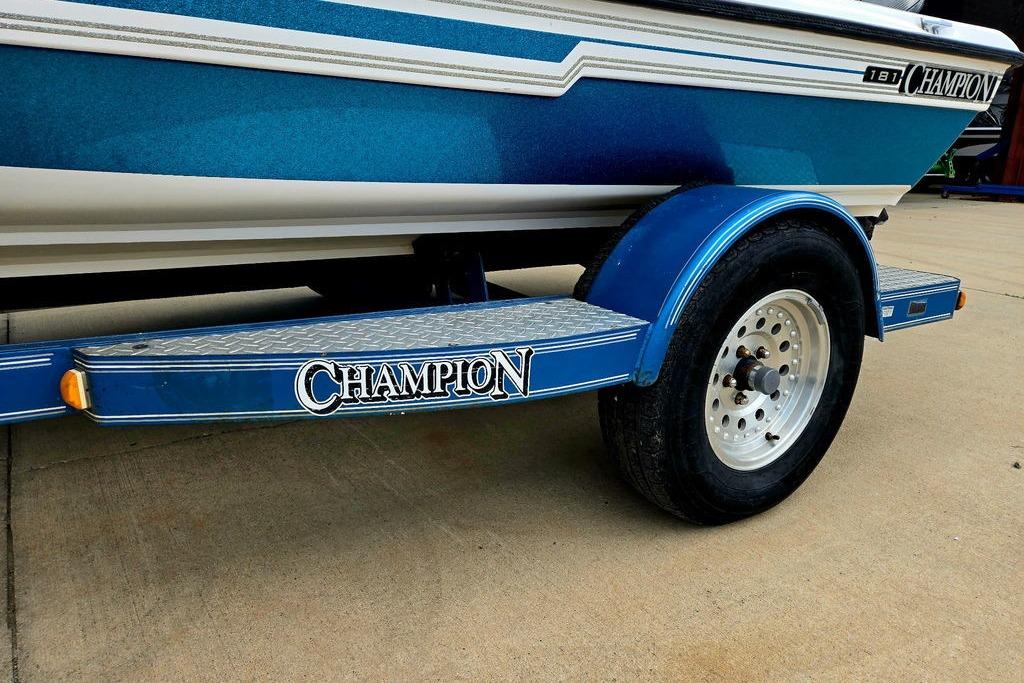 1996 Champion 181 SX boat trailer with blue accents and branded logo.