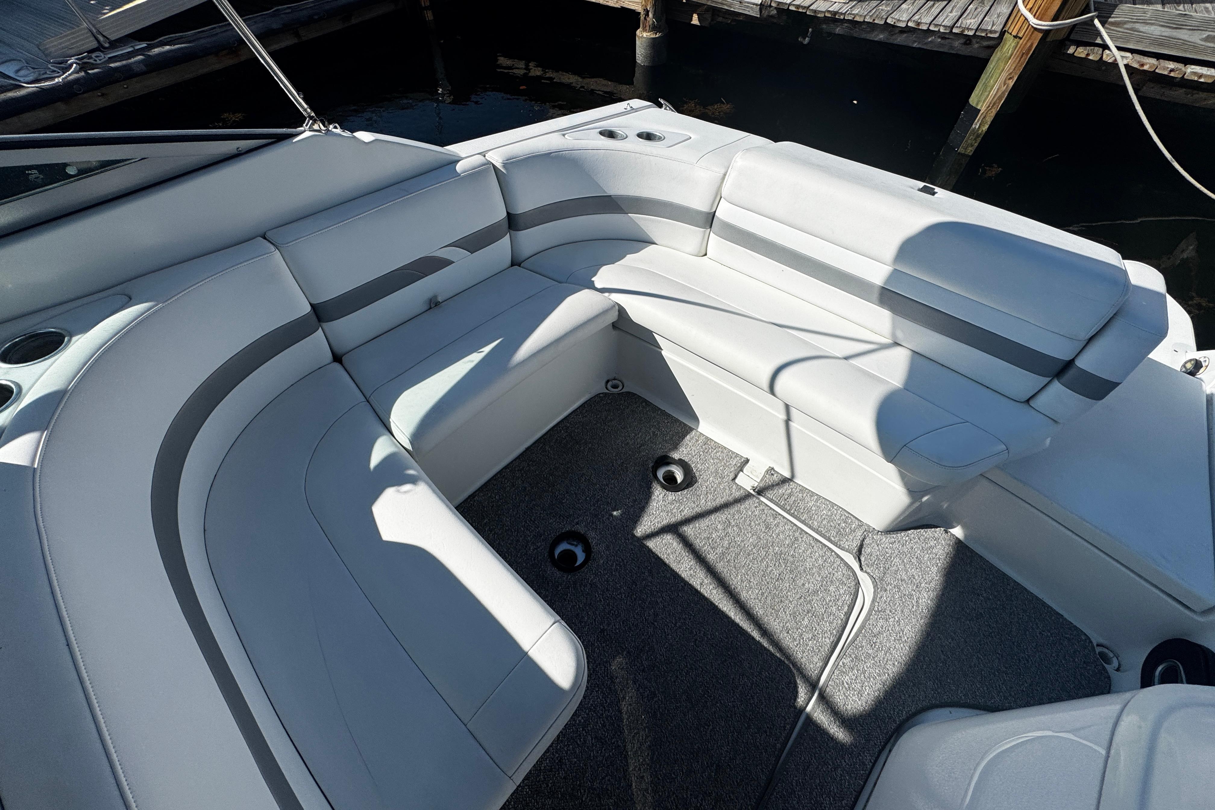 2004 Formula 280 Sun Sport boat interior with white seating and gray accents.