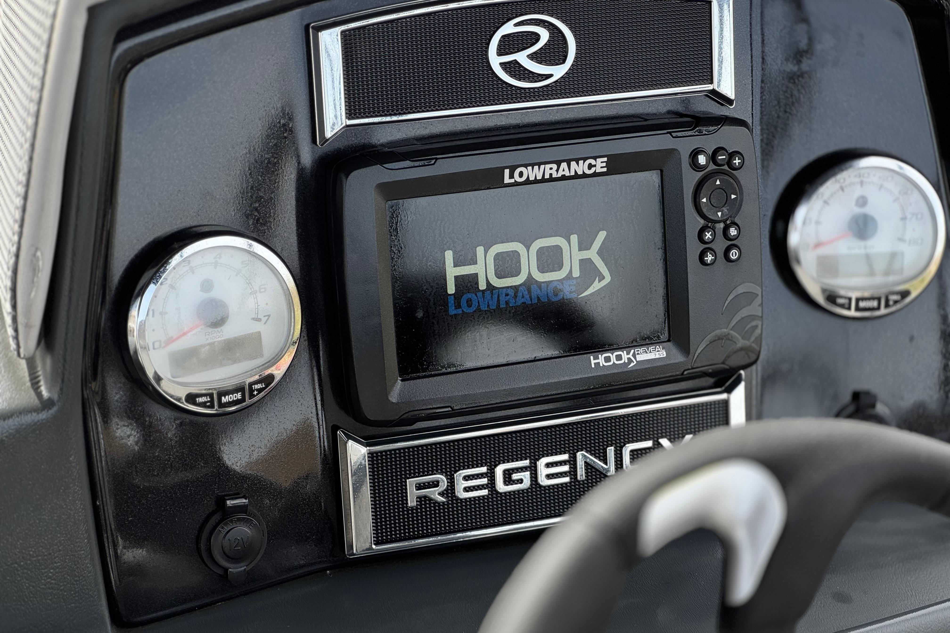 Dashboard of 2022 Regency 250 DL3 with Lowrance Hook fishfinder display.