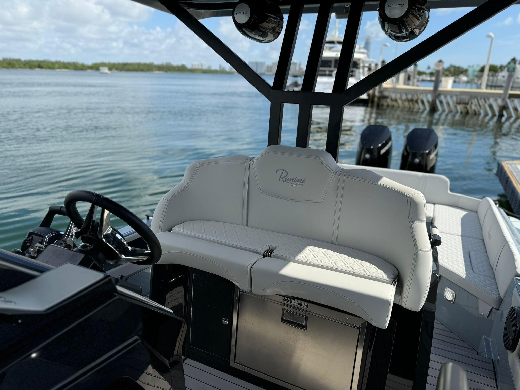 2025 Ranieri CAYMAN 38.0 EXECUTIVE boat interior with steering wheel and seating.