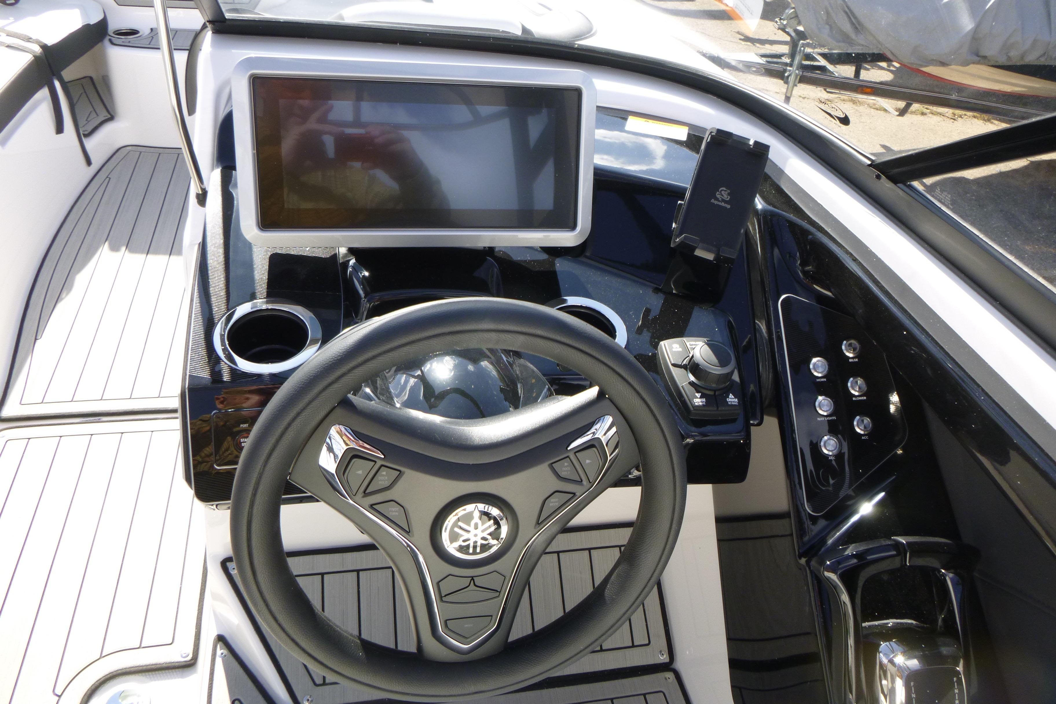 2026 Yamaha Boats 252SD dashboard with touchscreen, steering wheel, and control panel.