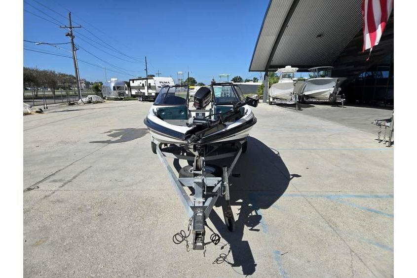 1997 Javelin 389 FS boat on trailer in outdoor storage area.