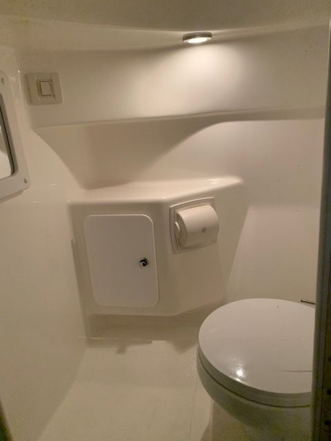 Interior of a 2001 Fountain Lightning boat bathroom.