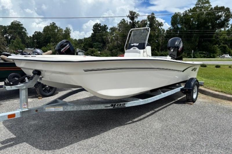 2026 Mako Pro Skiff 17 CC boat on trailer, parked outdoors.