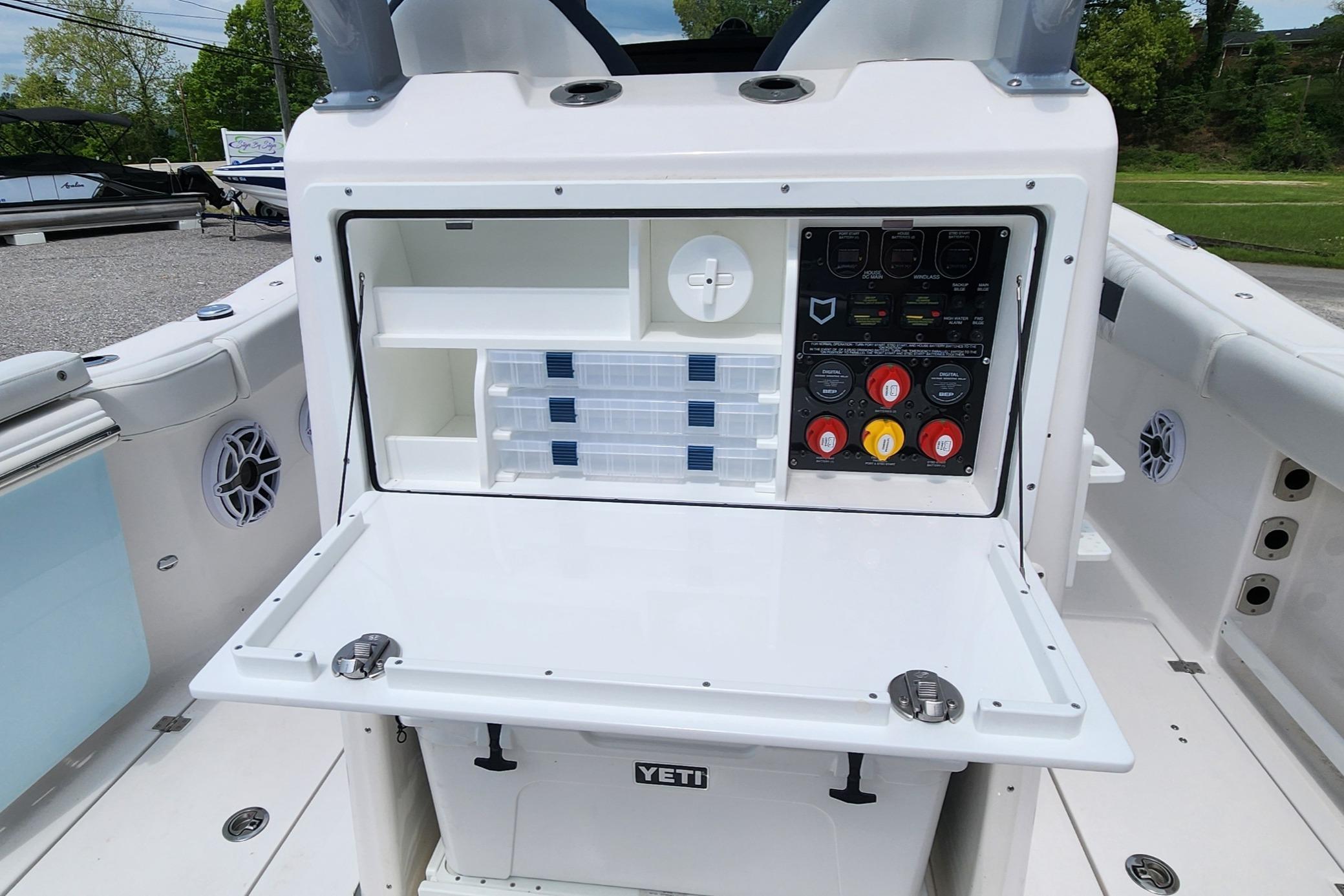 2025 Sea Fox 288 Commander boat console with storage and control panel.