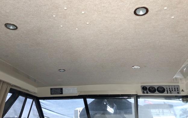 Interior of 1984 Silverton 34 Convertible with ceiling lights.