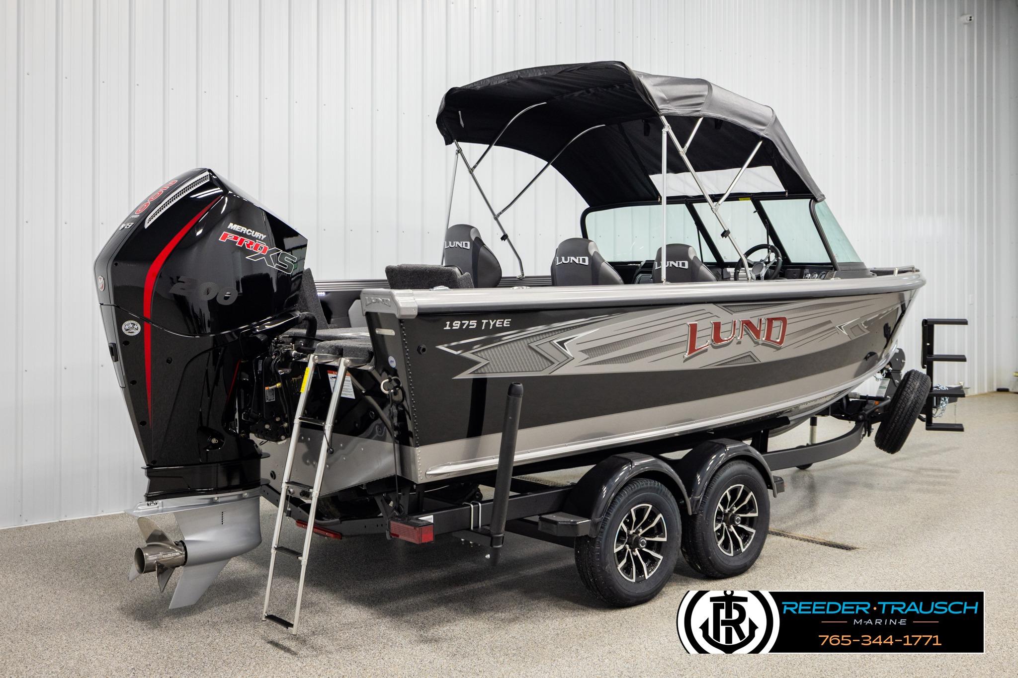 2026 Lund 1975 Tyee boat with Mercury Pro XS engine in showroom.