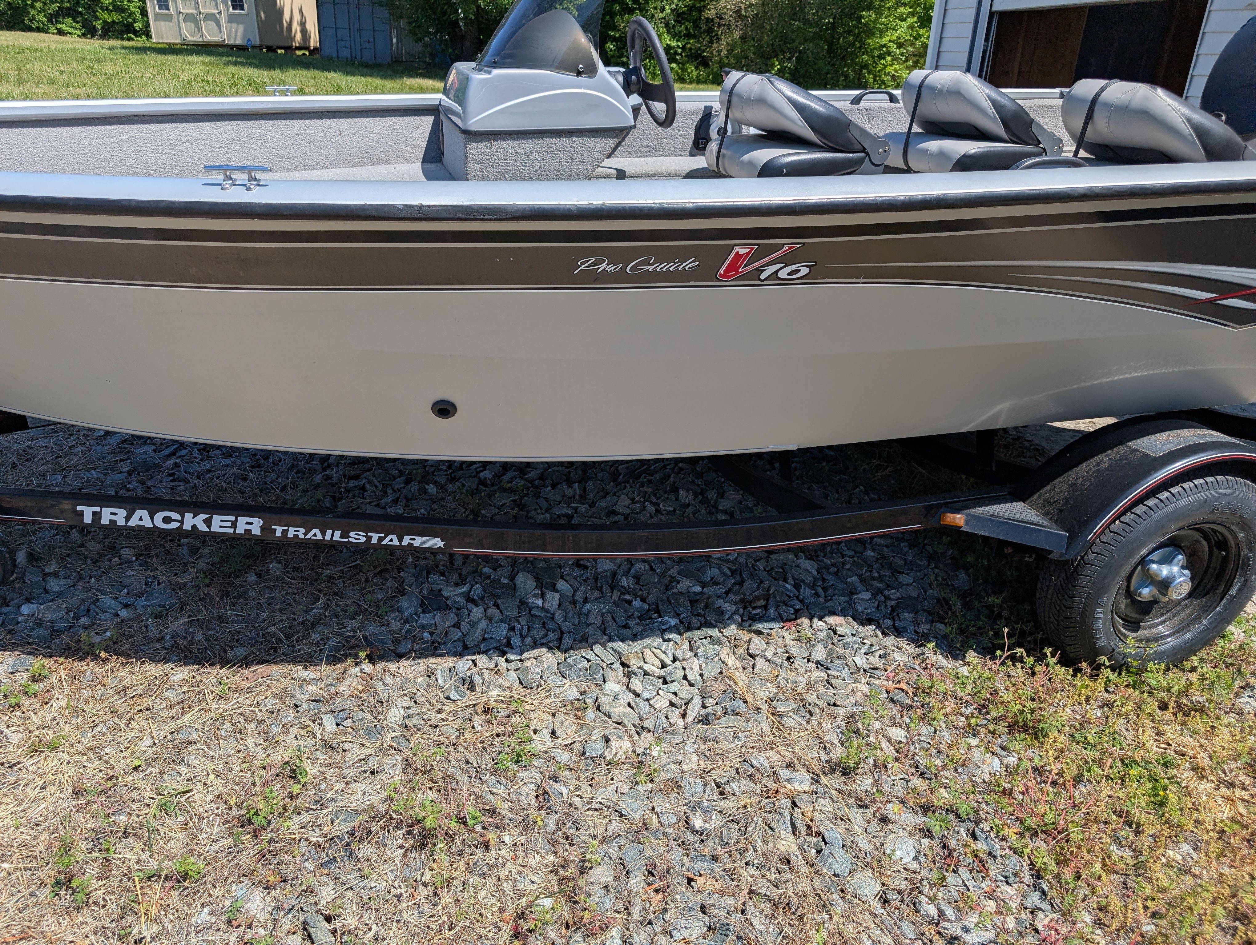 2009 Tracker Pro Guide V16 SE boat on trailer outdoors.