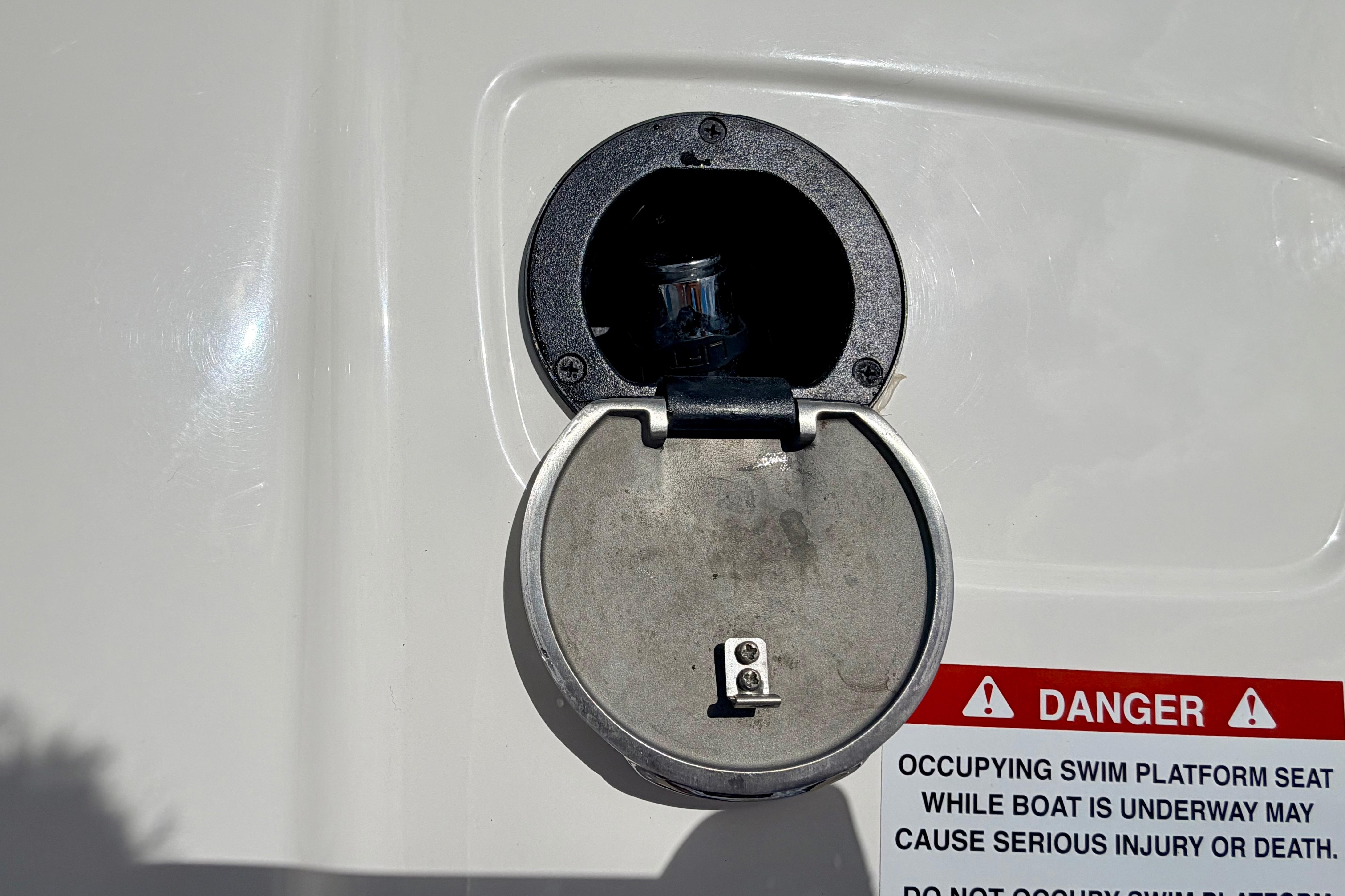 Fuel cap of 2015 Chaparral Sunesta 264 boat with safety warning label.