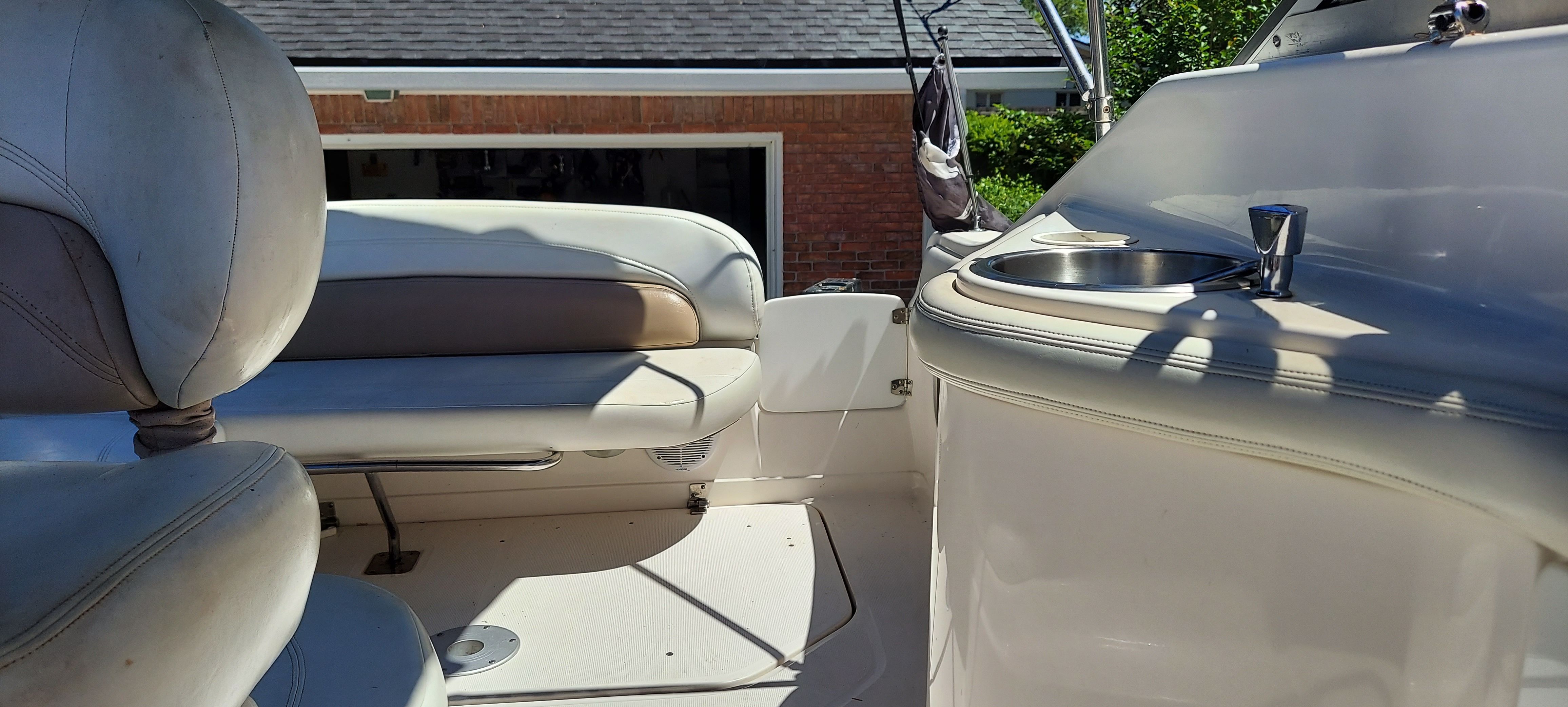 Interior of a 2004 Regal Commodore 2465 boat with seating area.