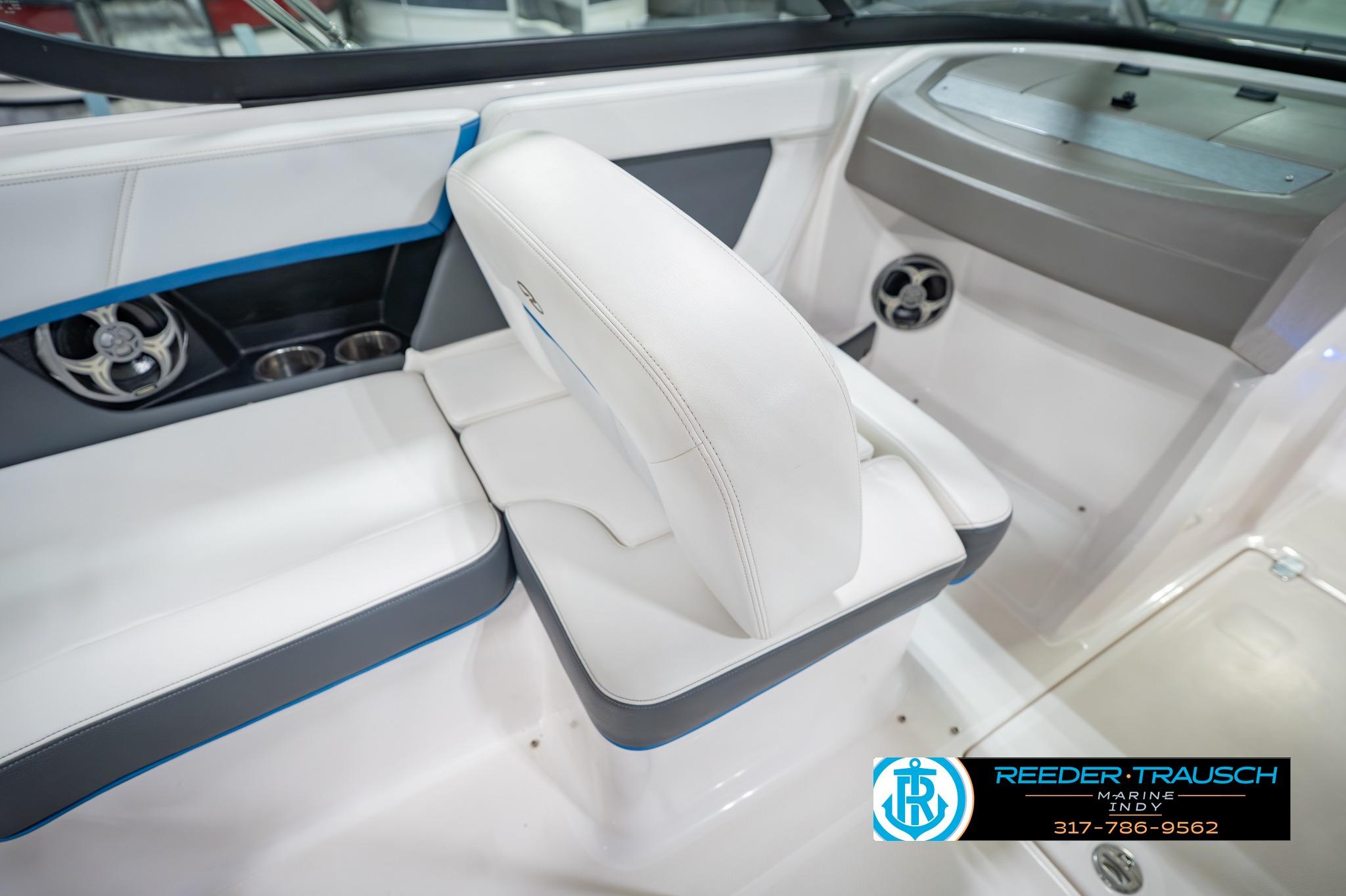 Interior of 2015 Regal 2000 ESX Bowrider with white seating and speaker system.