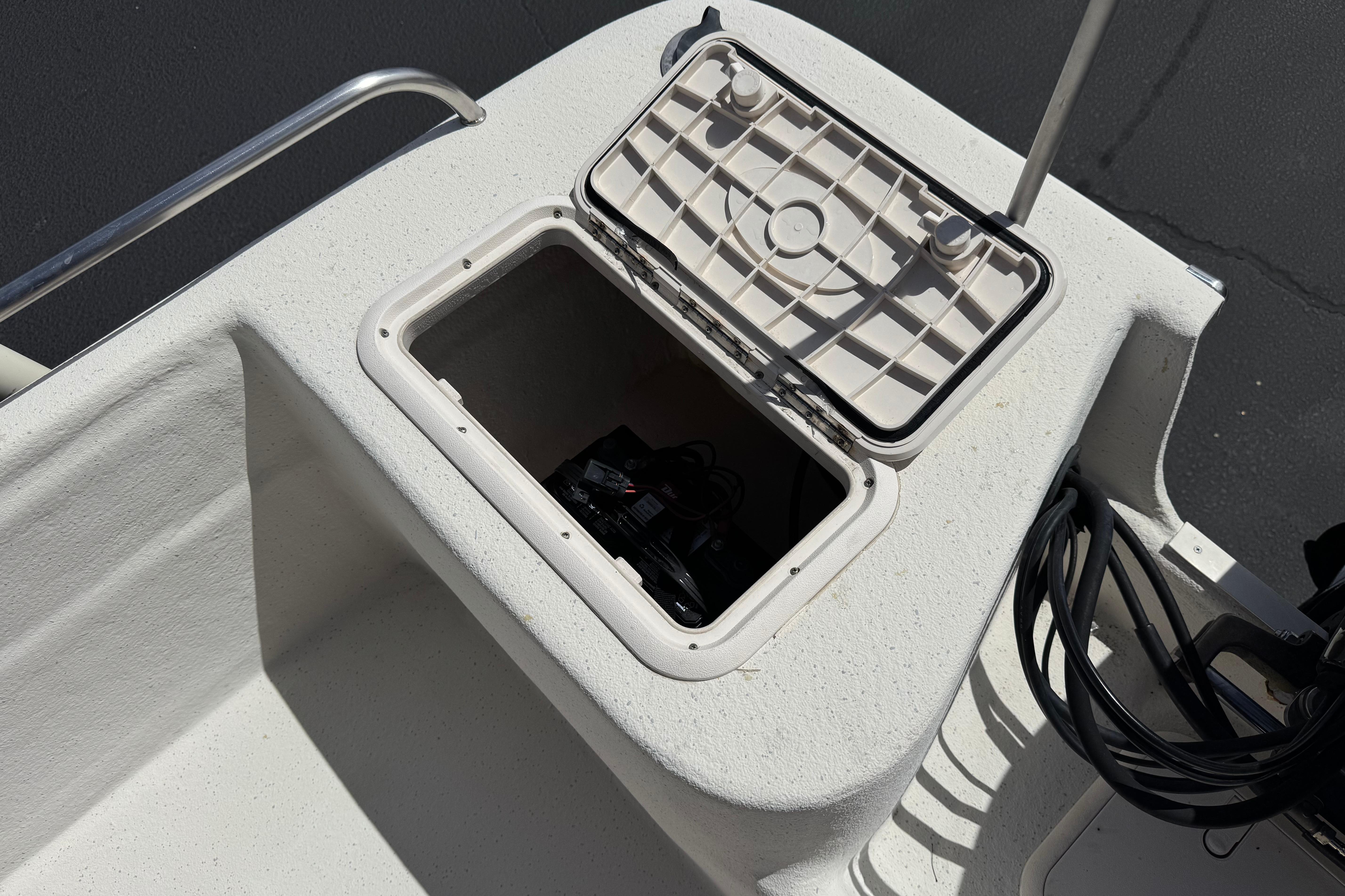 Open storage compartment on 2013 Carolina Skiff Sea Chaser 1950 RG boat.