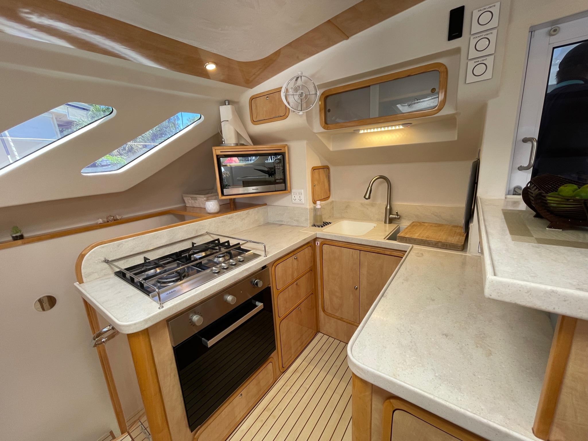 Modern kitchen in a 2016 Knysna 500 SE yacht.