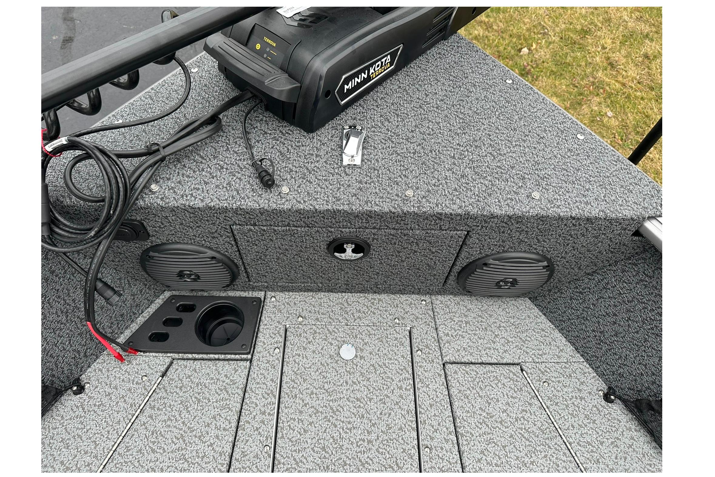 2026 Lund 1875 Impact XS SS boat interior with Minn Kota trolling motor and speakers.