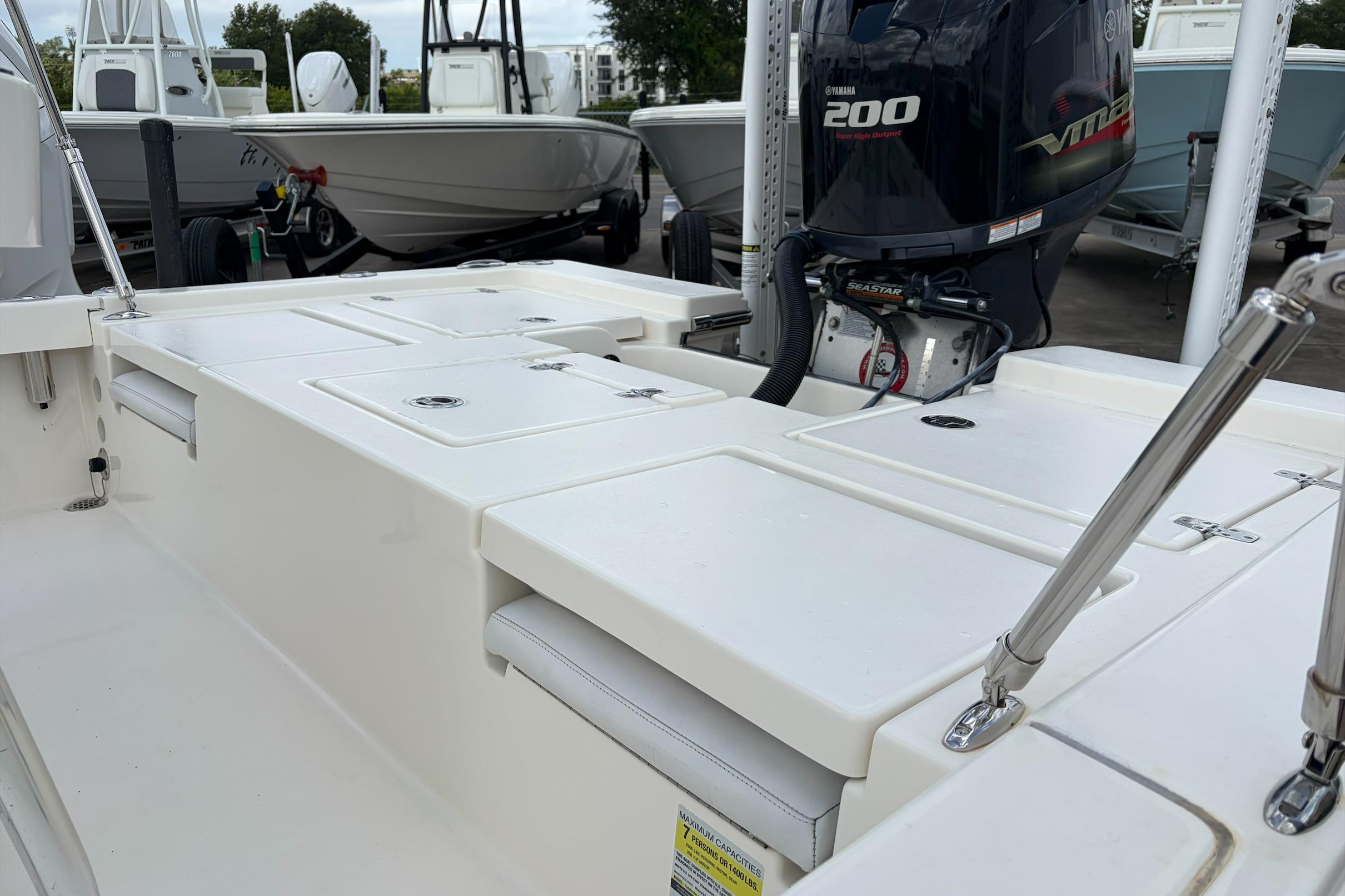 2017 Pathfinder 2200 TRS boat with Yamaha 200 engine, docked alongside similar vessels.