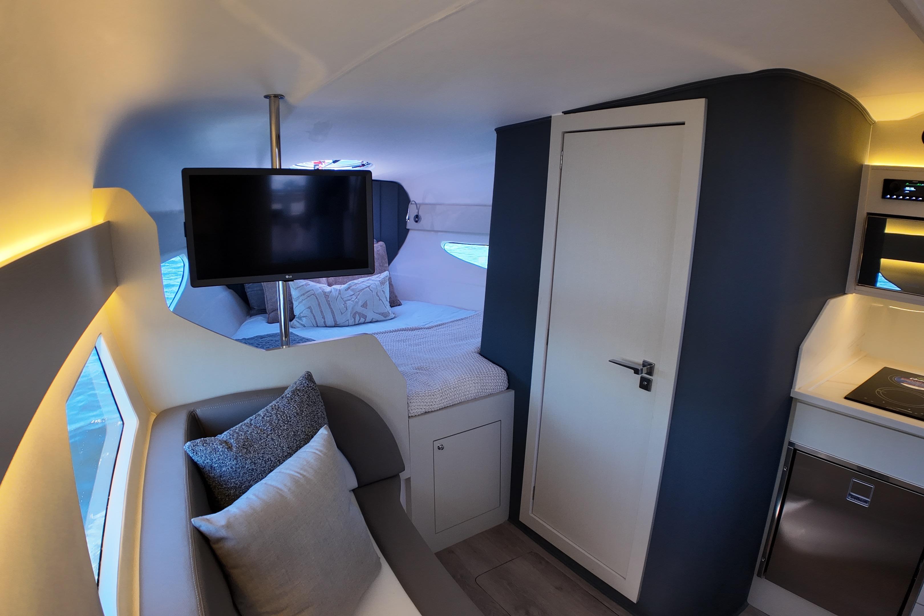 Luxurious interior of 2025 Valiatt 350GT yacht with modern amenities and cozy seating.