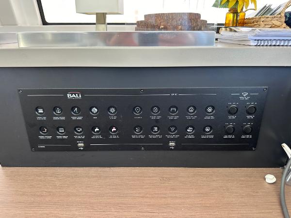 Control panel of a 2021 Bali 4.8 yacht with various switches and indicators.