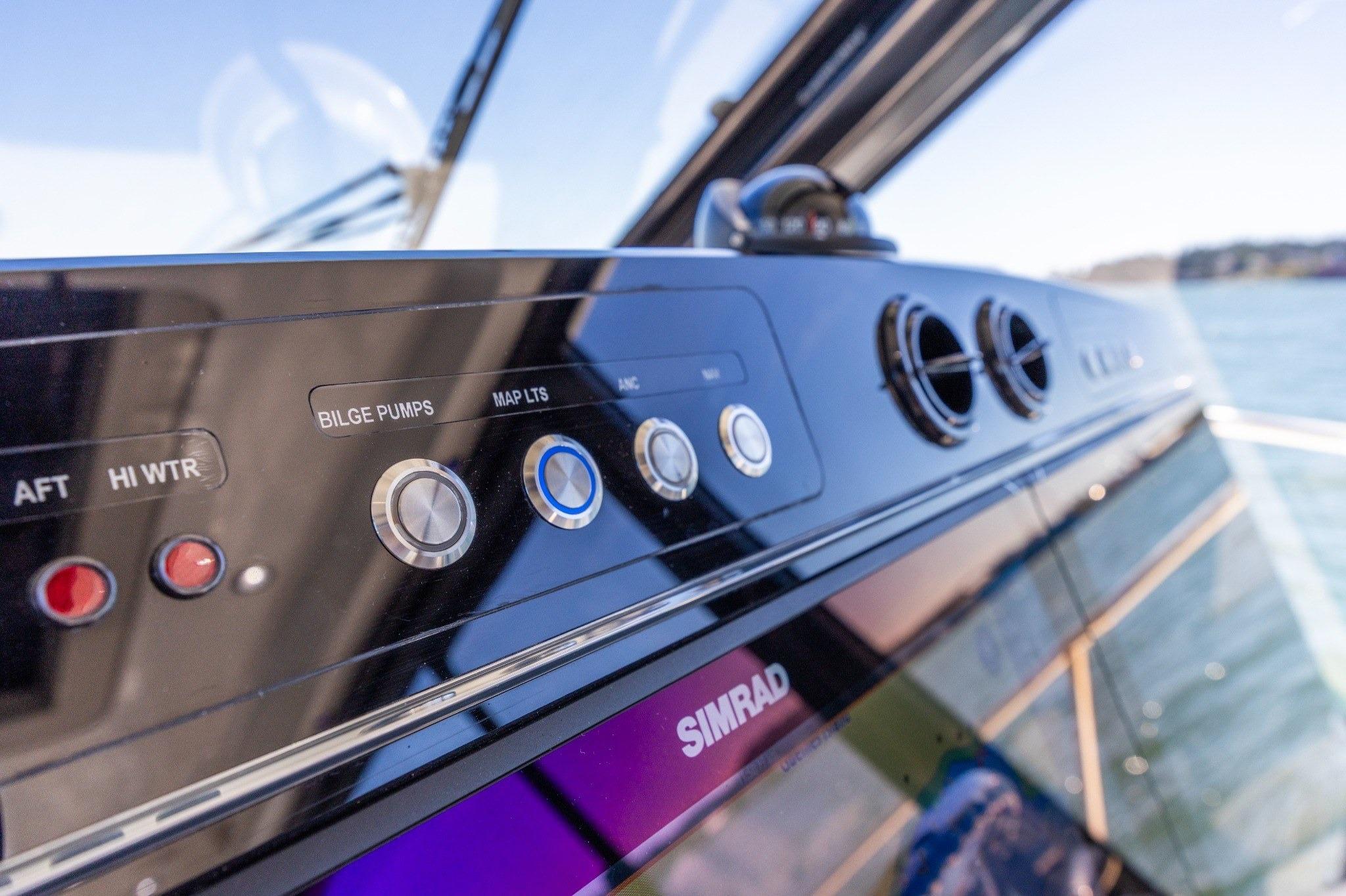 Control panel of 2023 Boston Whaler 405 Conquest boat with Simrad electronics.