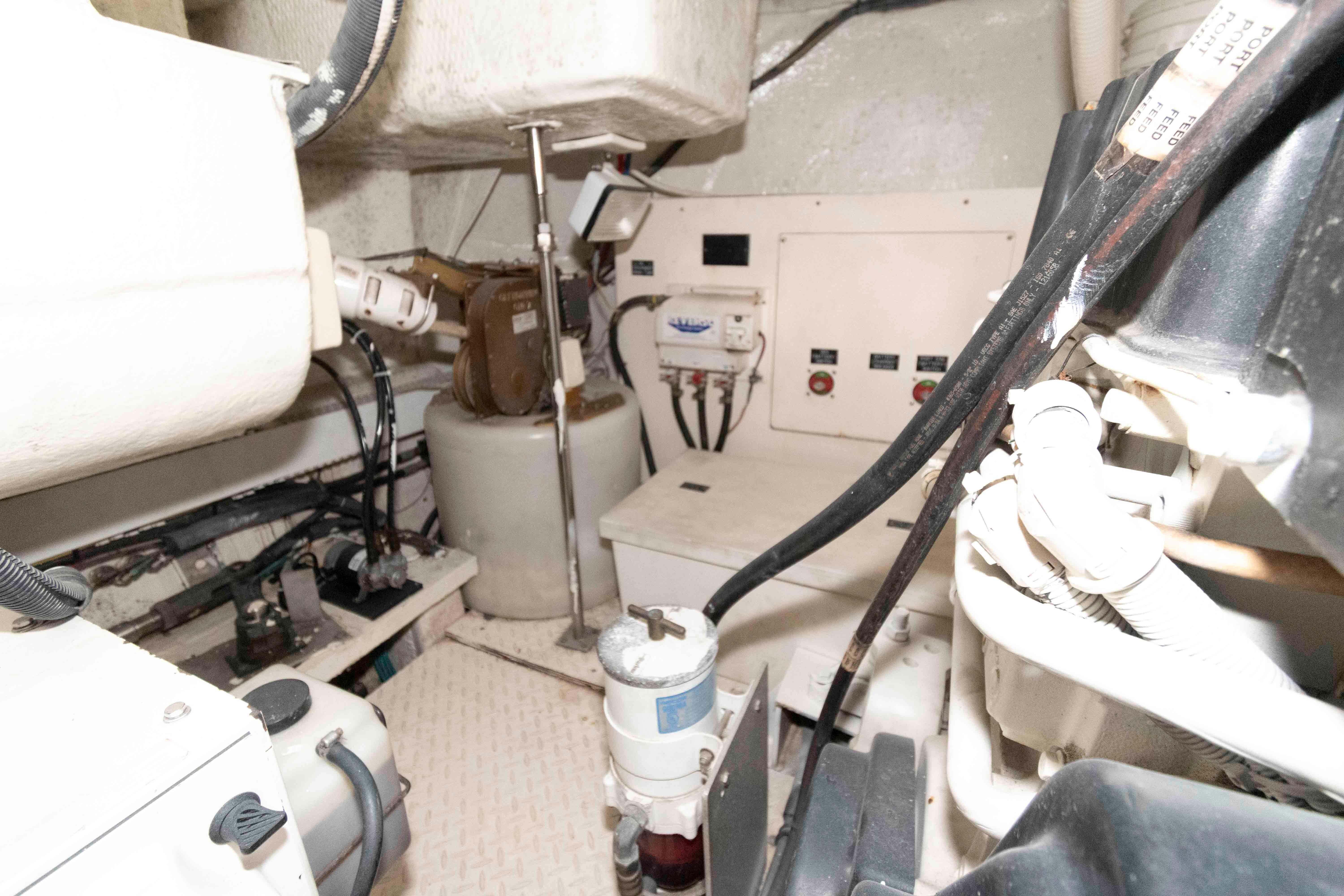 Engine room of 2007 Cruisers Yachts 520 Express, showcasing mechanical components and wiring.