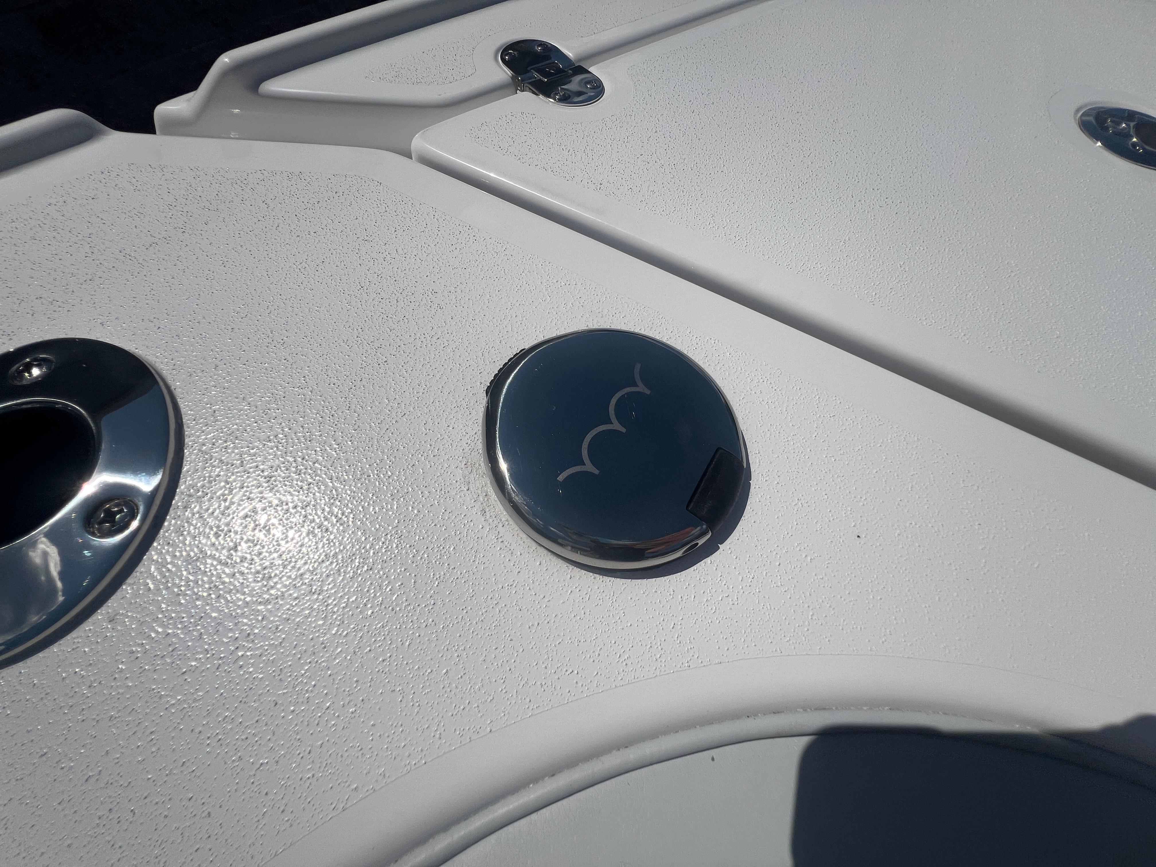 2026 Blackfin 262 HB boat deck with chrome fittings and textured surface.