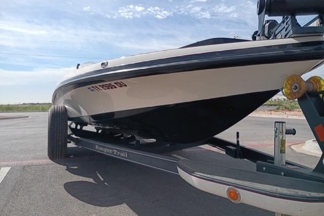 2017 Ranger Z521 Comanche Cup-Equipped boat on trailer, parked outdoors.