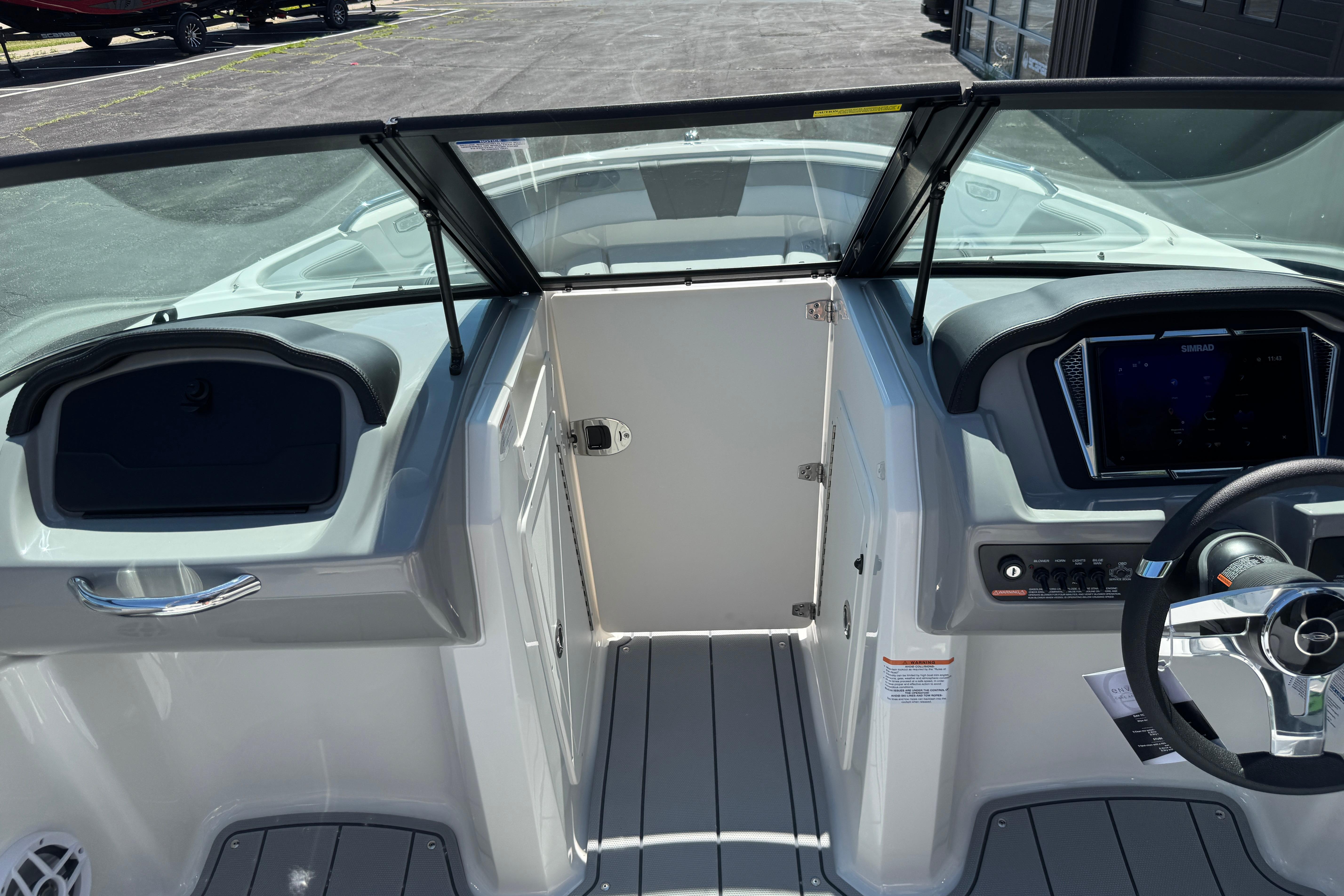 2026 Chaparral 21 SSi boat interior with modern dashboard and steering wheel.