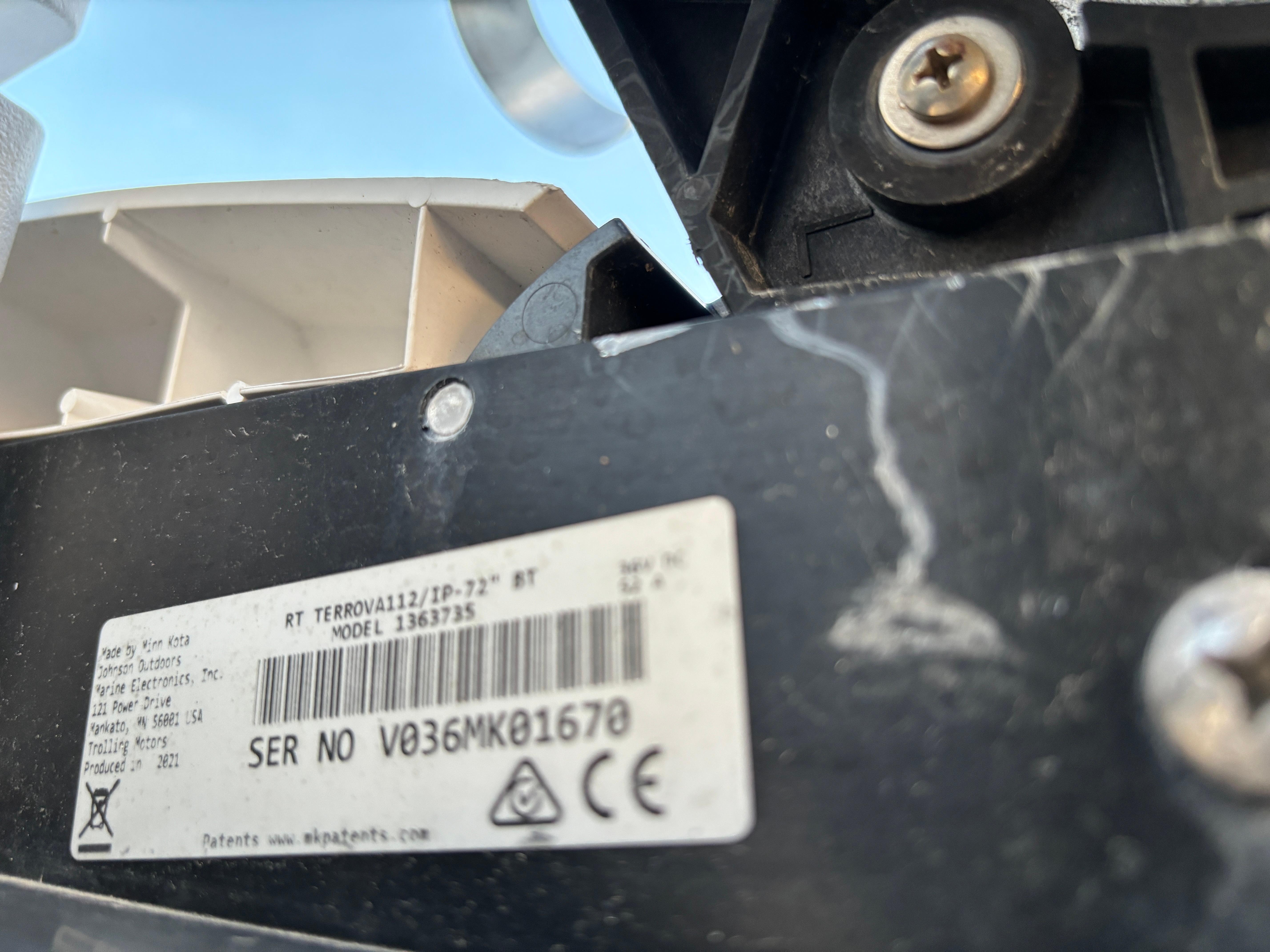 Close-up of a KenCraft 21 boat component with a visible serial number label.