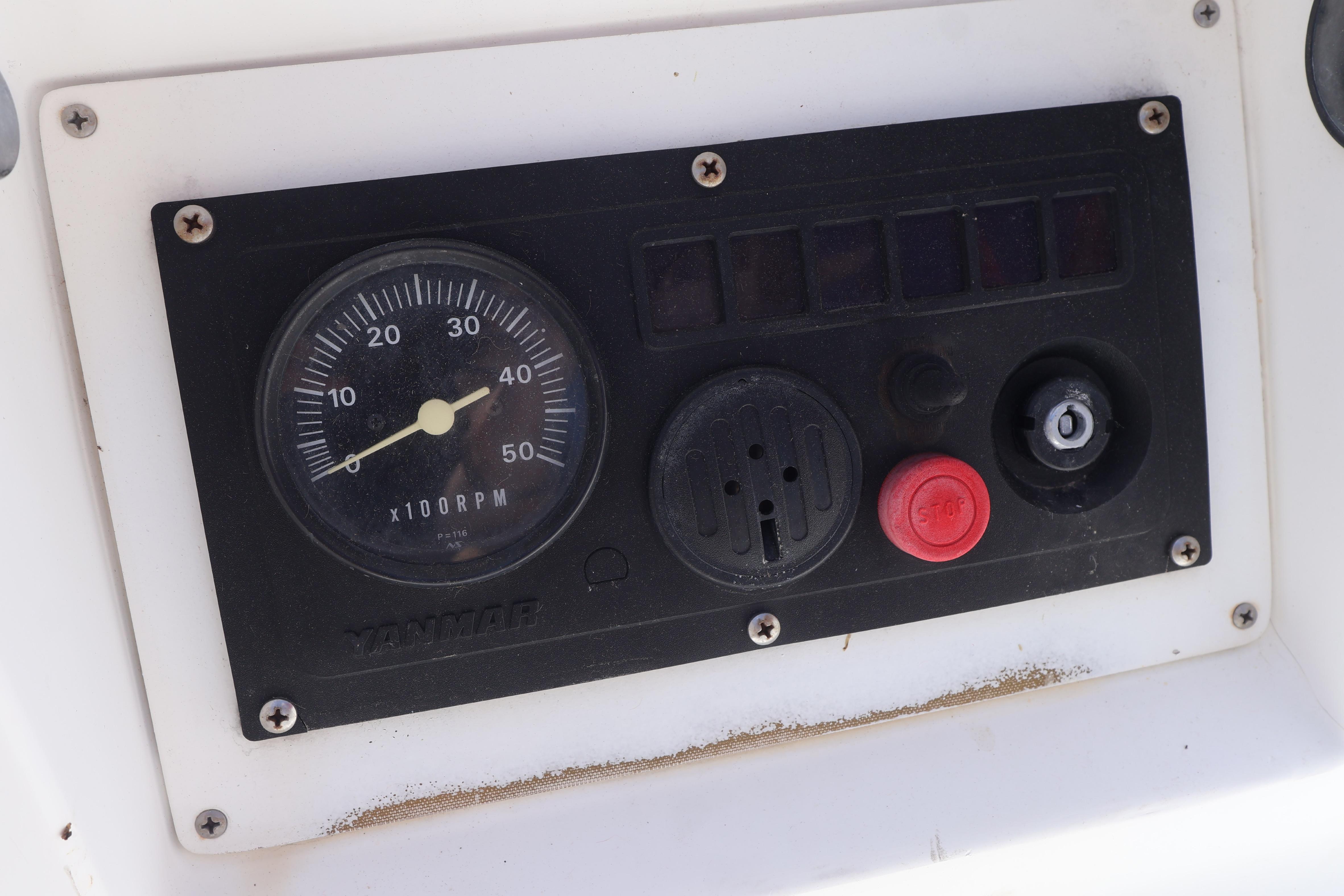 Control panel of a 1989 J Boat J 40 with Yanmar RPM gauge.