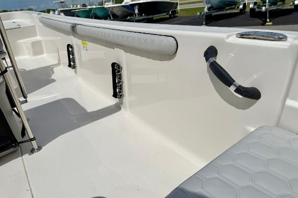 2025 Carolina Skiff 21 LS boat interior with cushioned seating and grab handles.