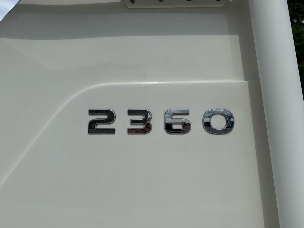 Close-up of 2025 Ranger 2360 Bay model emblem on boat exterior.