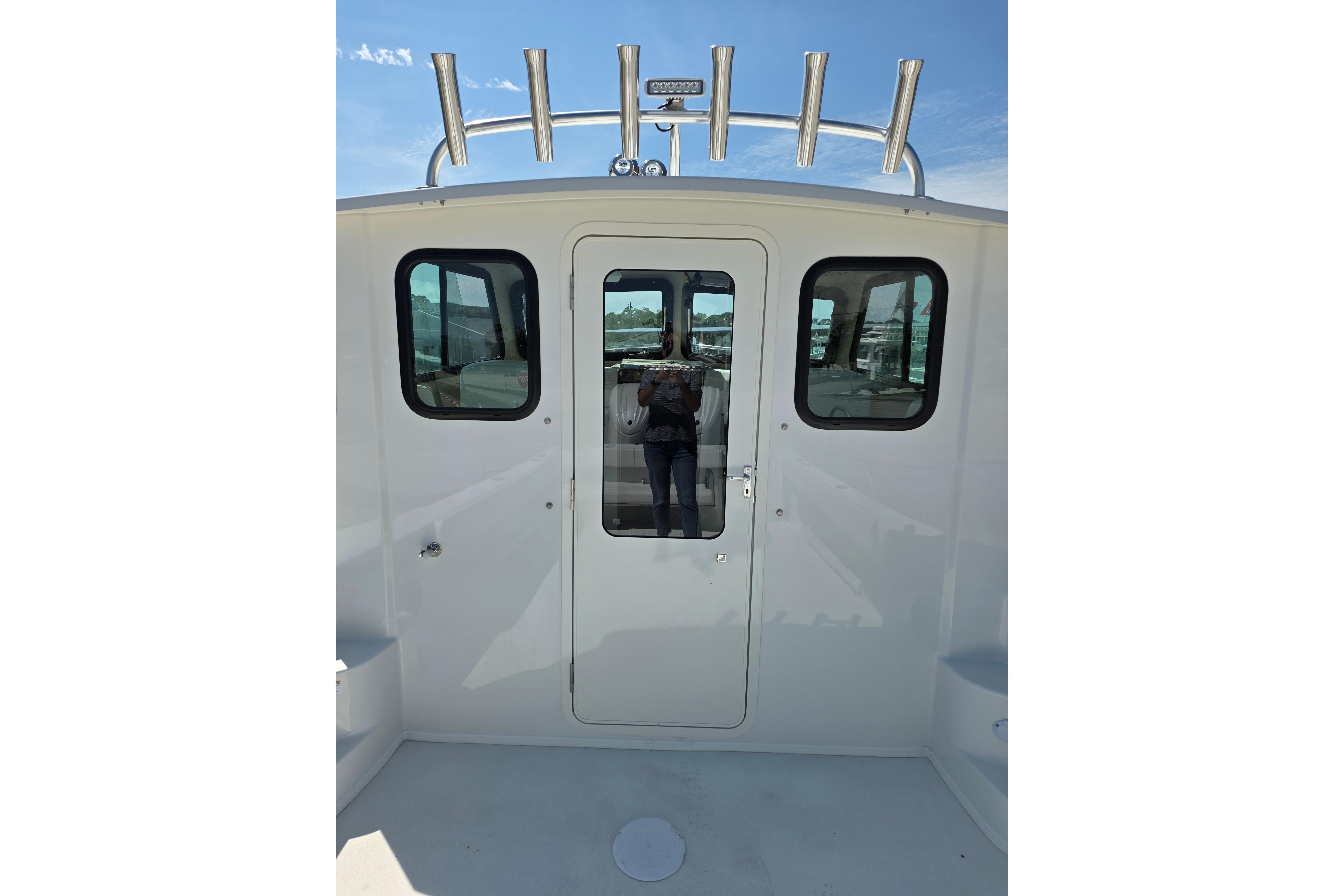 2026 Parker 287 Explorer boat cabin entrance with windows and rod holders.