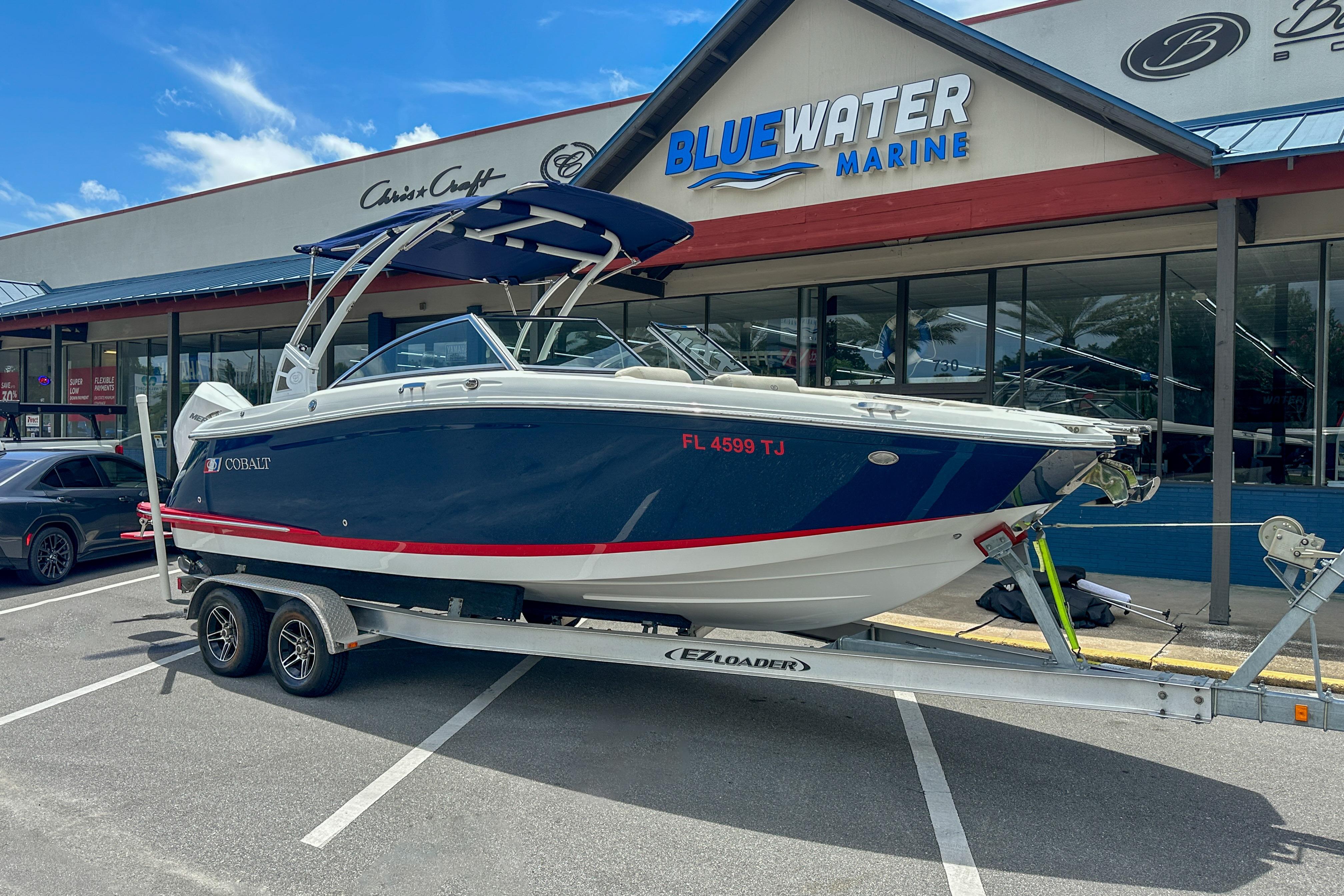 2022 Cobalt 25SC boat on trailer at Bluewater Marine dealership.
