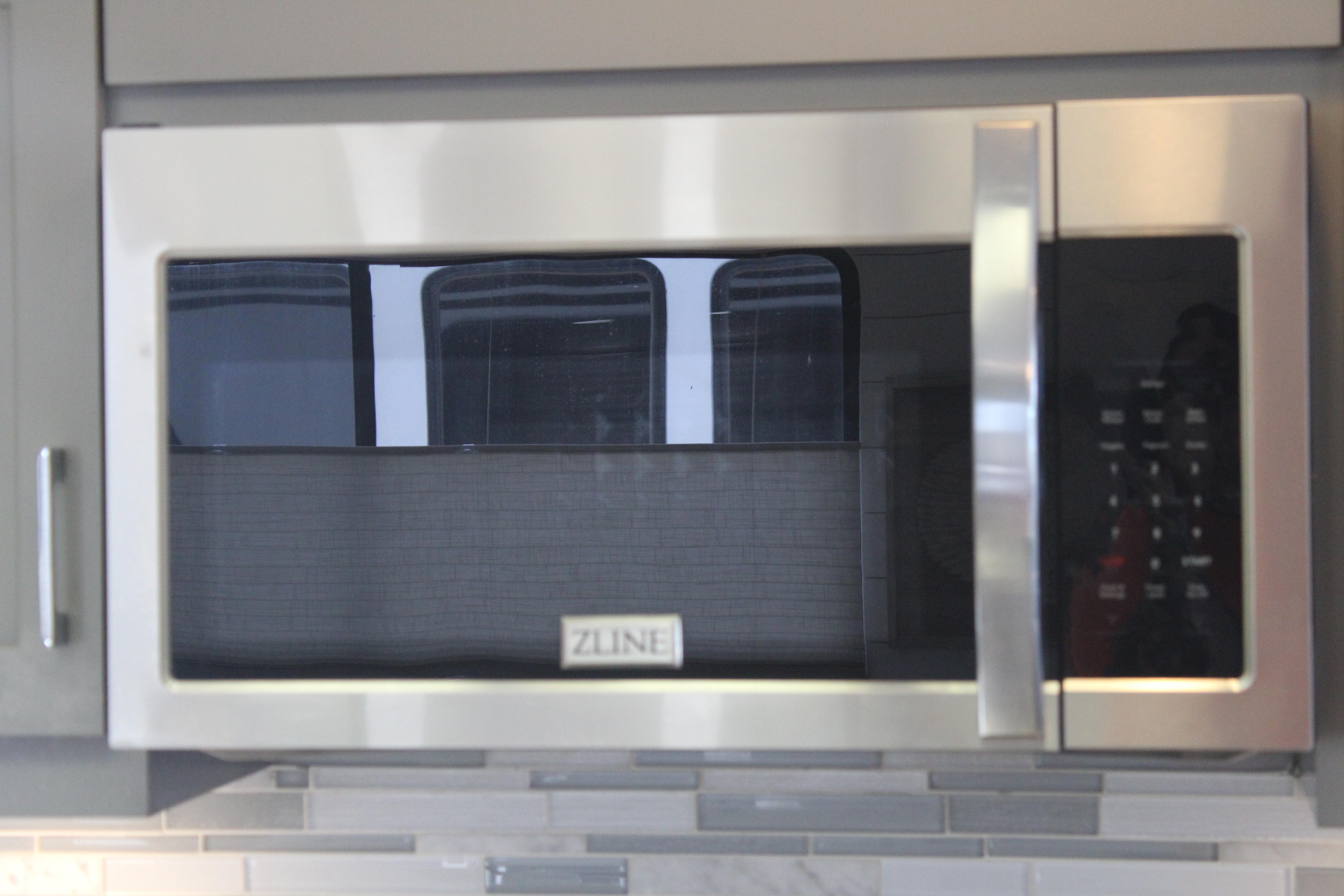 Stainless steel ZLINE microwave in modern kitchen setting, Sumerset 66, 1992 model.