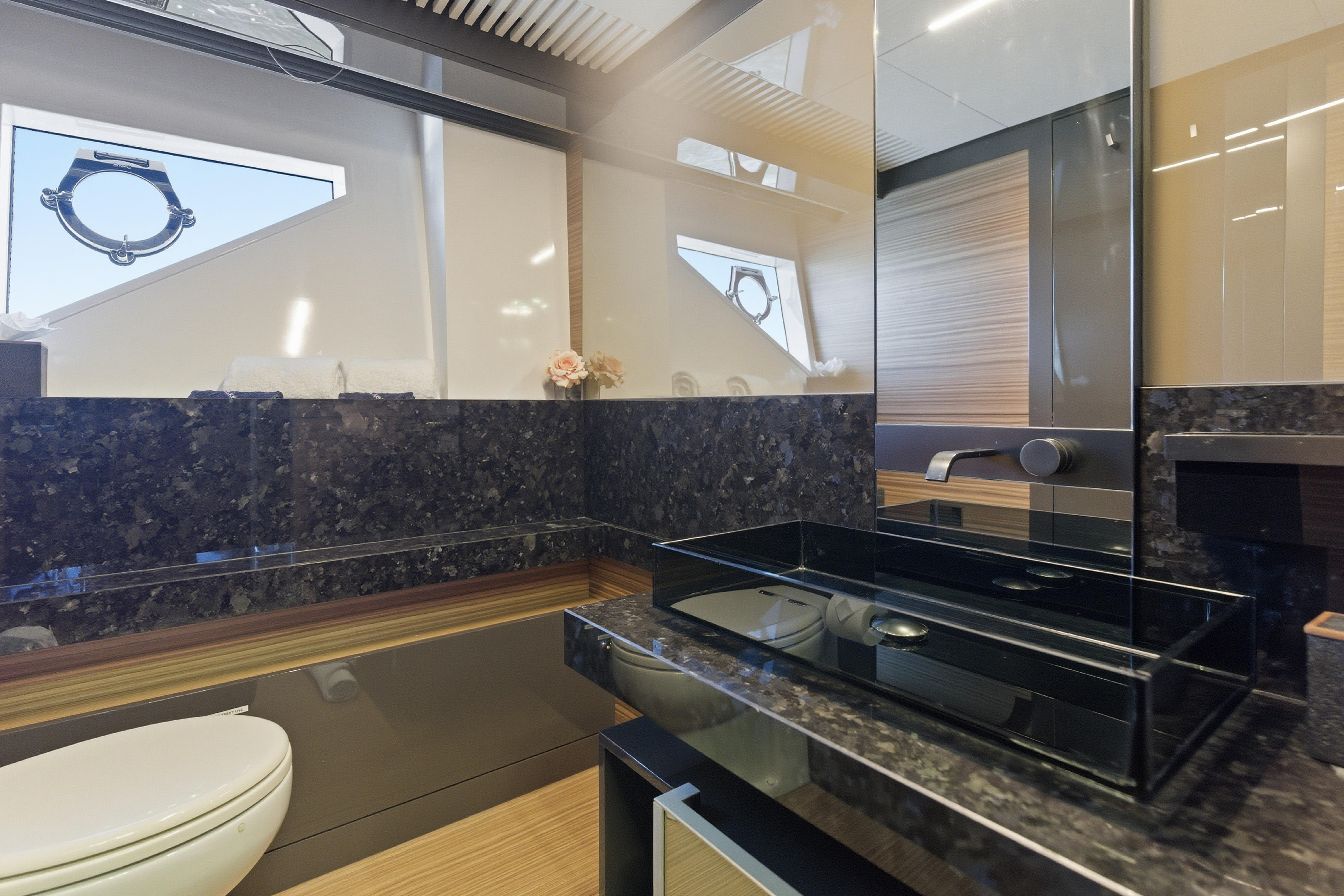 Luxurious bathroom interior of 2018 Ferretti Yachts 920 with modern fixtures and elegant design.