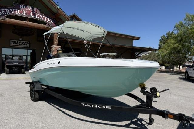 2026 Tahoe T18 boat on trailer at service center, featuring sleek design and canopy.