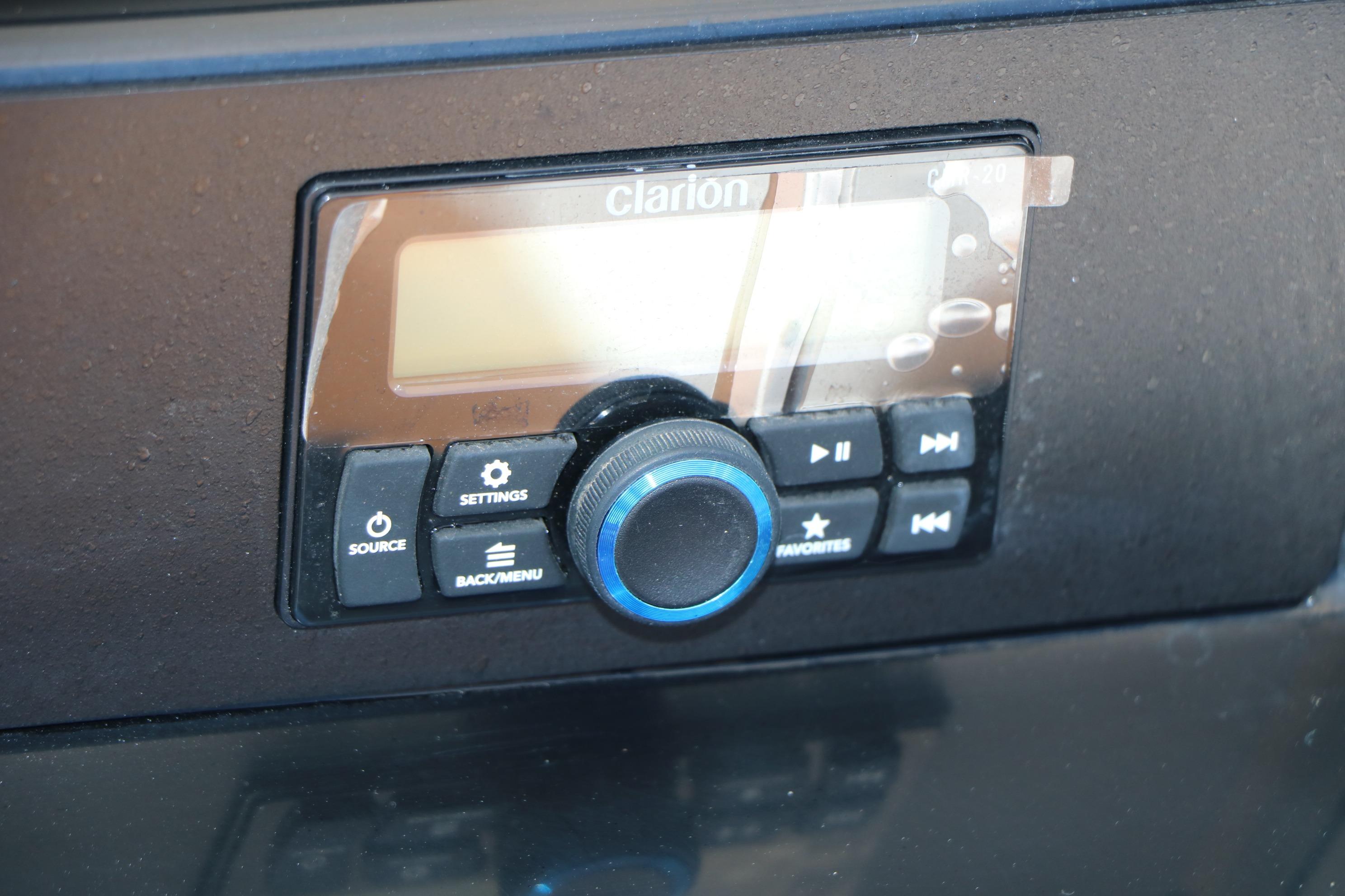 Clarion audio system in 2026 Robalo 246 Cayman boat dashboard.