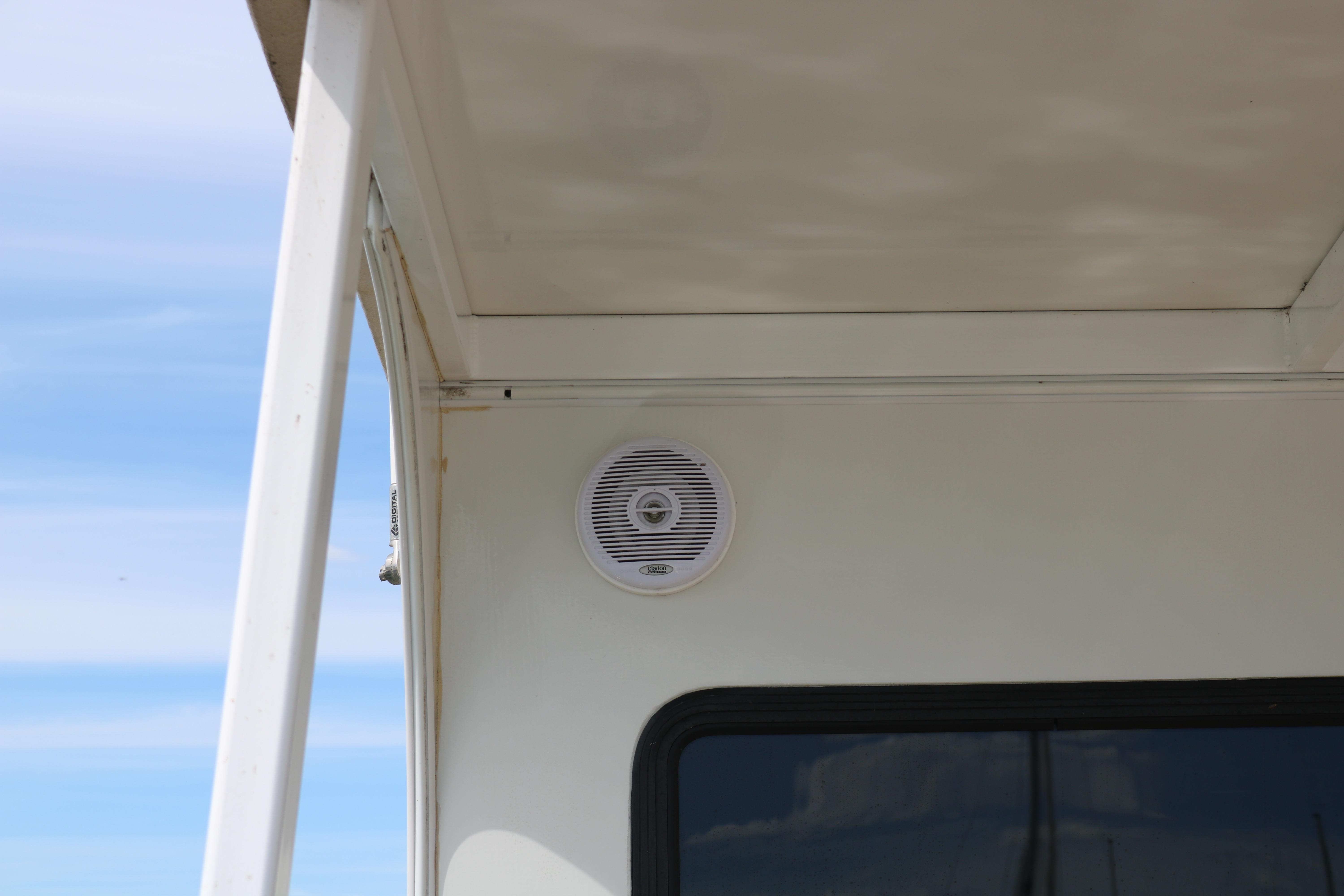 Exterior speaker on 2010 Skipperliner 480 Flybridge boat under clear sky.