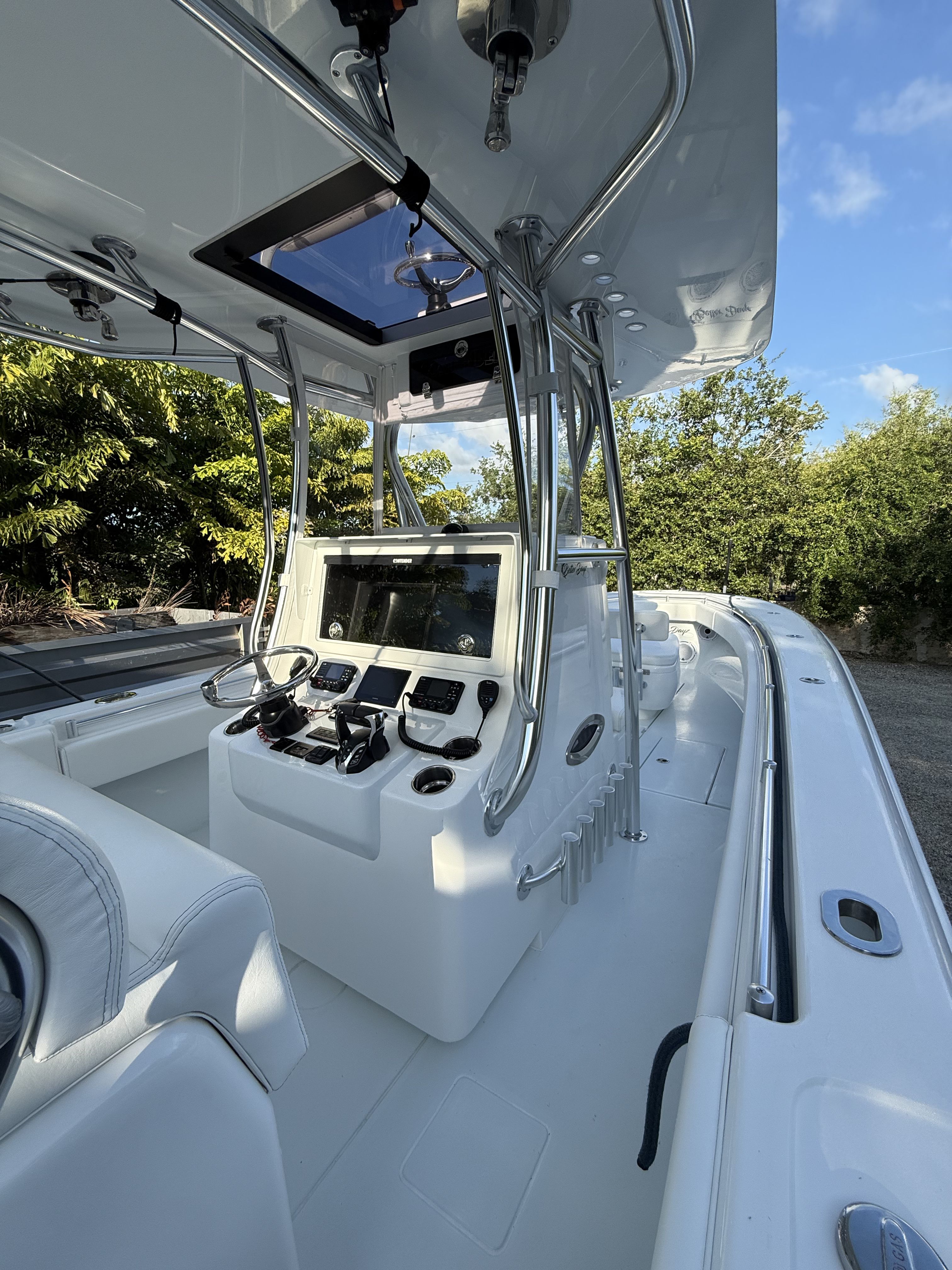 The image shows the cockpit of a 2026 Contender 35 ST boat with modern equipment.