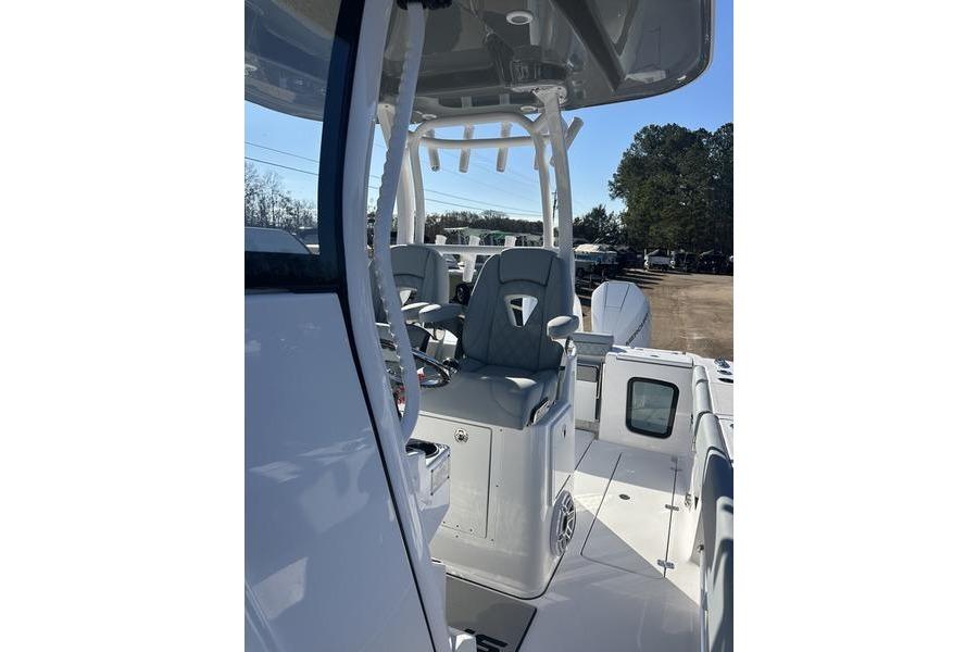 2026 Sportsman Open 282 Center Console boat interior with seating and console view.