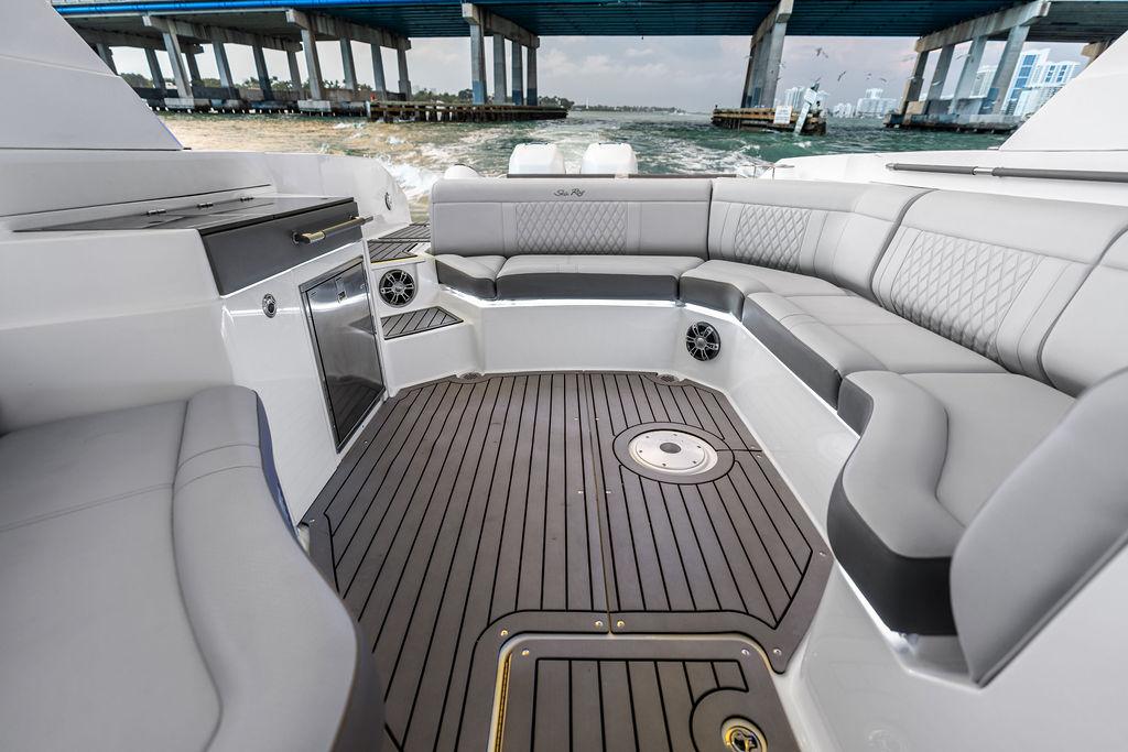 Luxurious interior of 2021 Sea Ray 350 SLX OB boat with sleek seating and modern design.