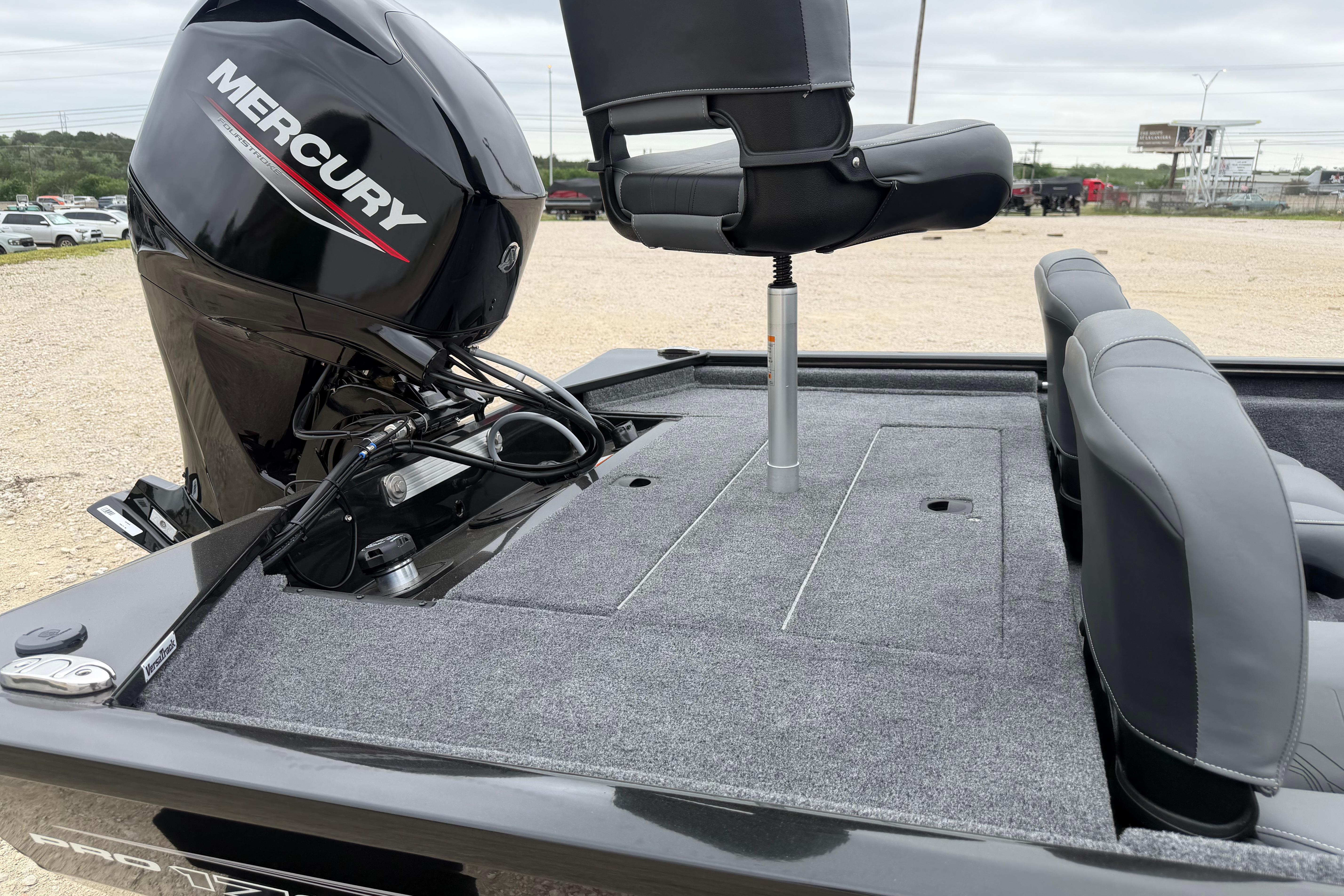 2026 Tracker Pro 170 boat with Mercury engine, featuring gray seating and carpeted deck.