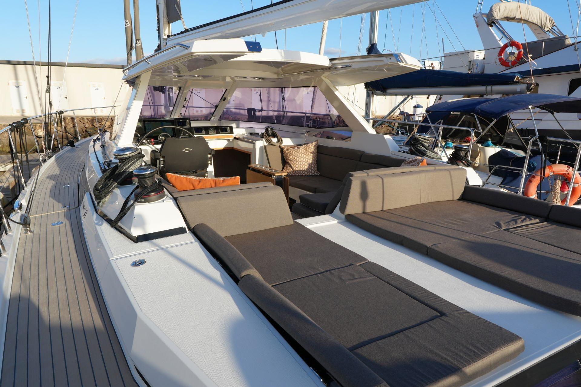 Luxurious 2020 Amel 50 yacht with spacious deck and modern seating area.