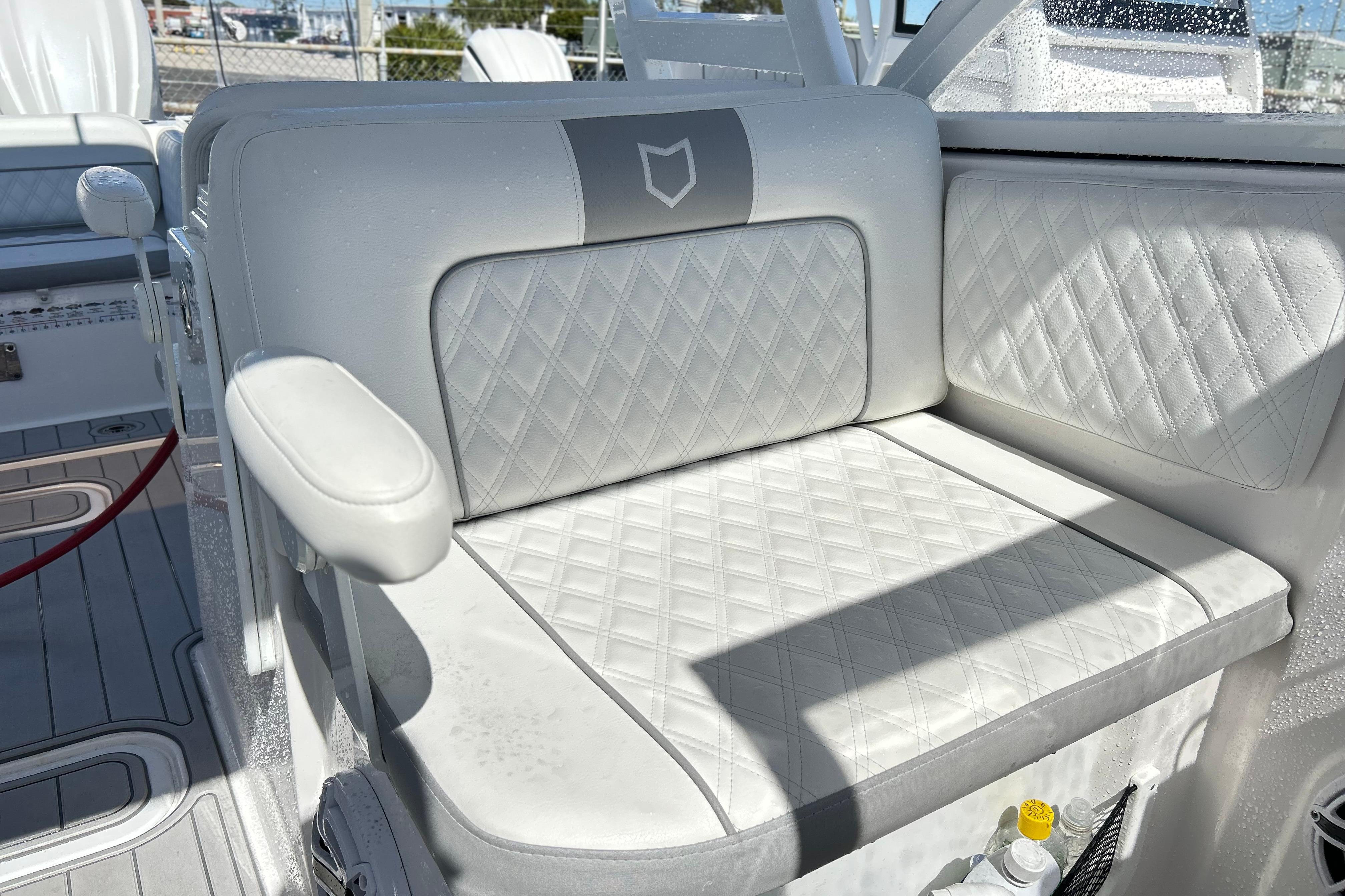 2025 Sea Fox 288 Traveler boat seat with diamond-stitched white upholstery.